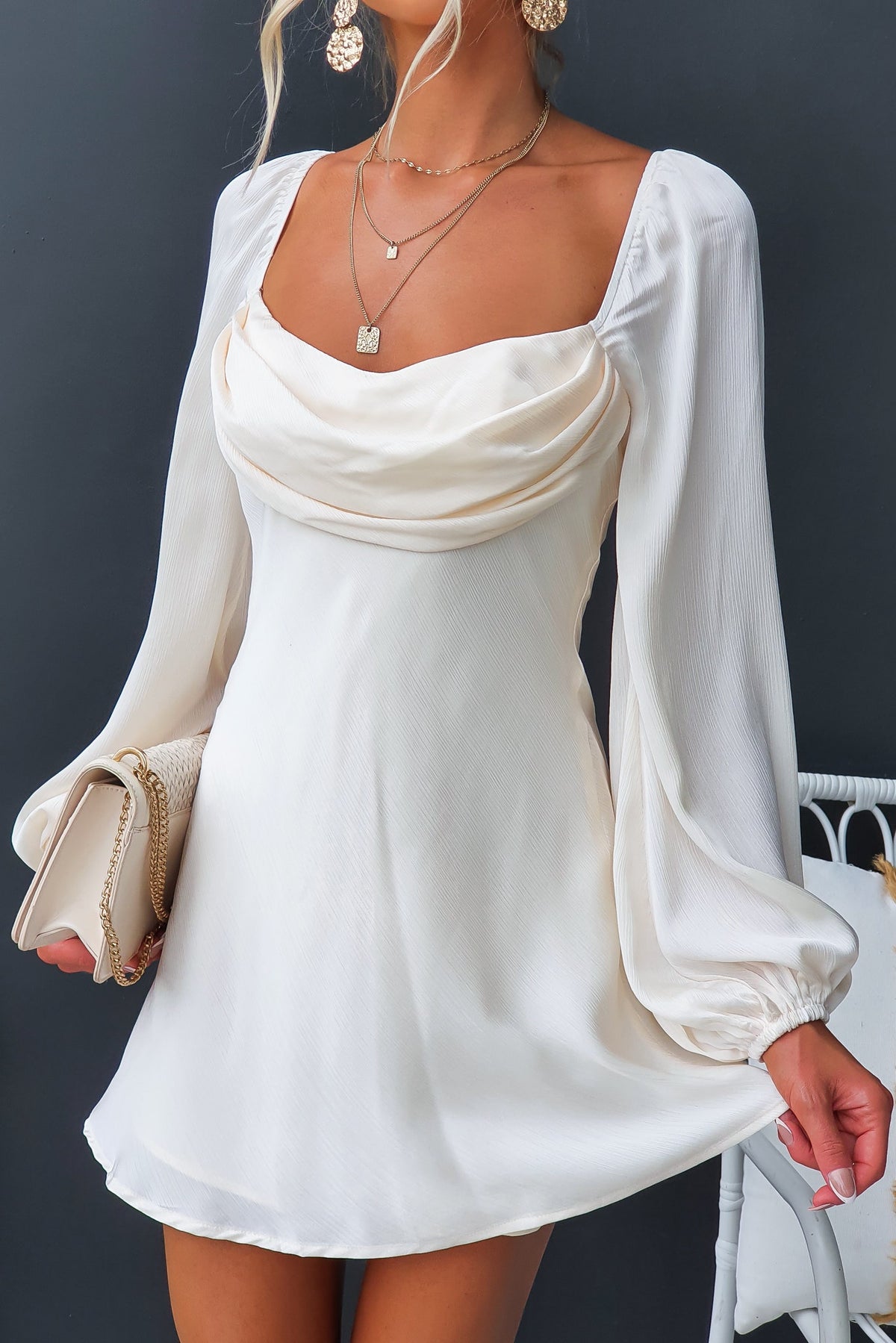 Averi Dress featuring elastic sleeves, fabric overlay at bust, and lightweight textured material, perfect for any occasion.
