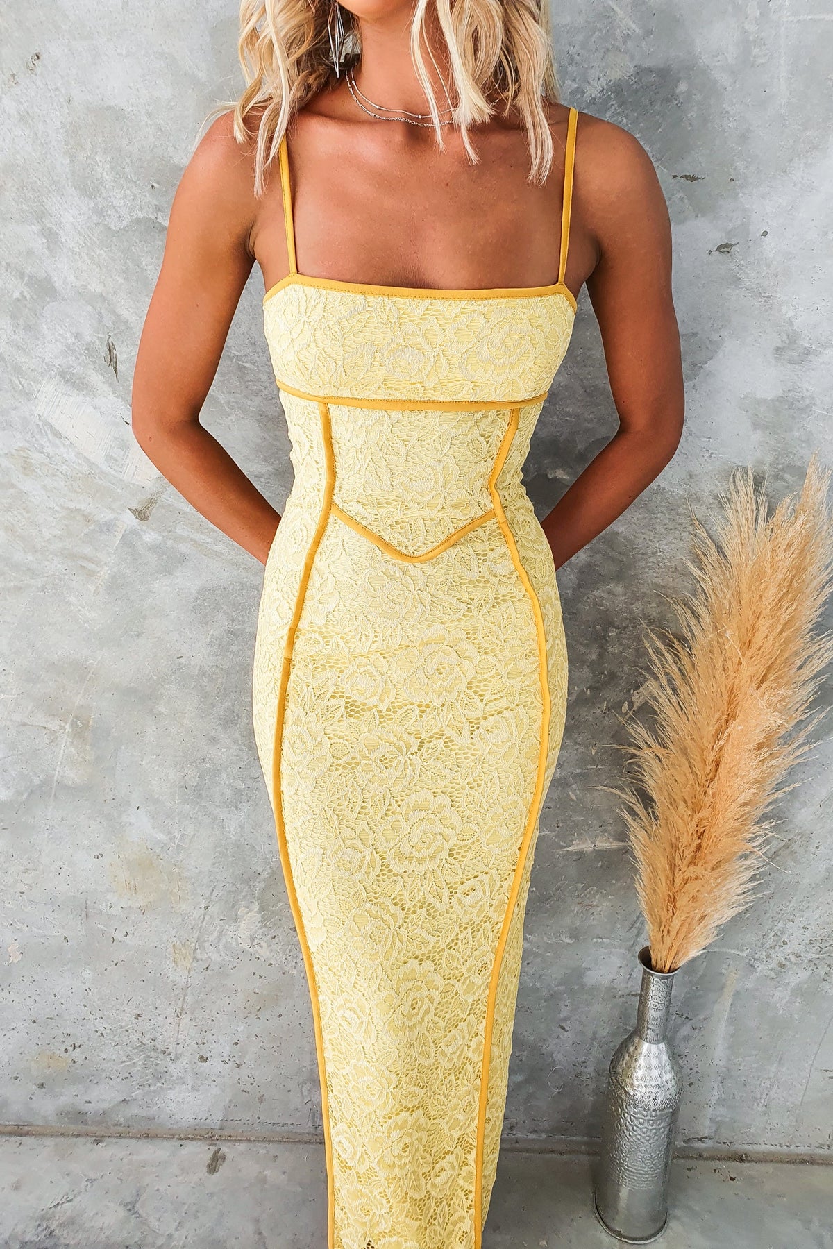 Charisma Maxi Dress in yellow lace with adjustable straps and back split, perfect for summer events.