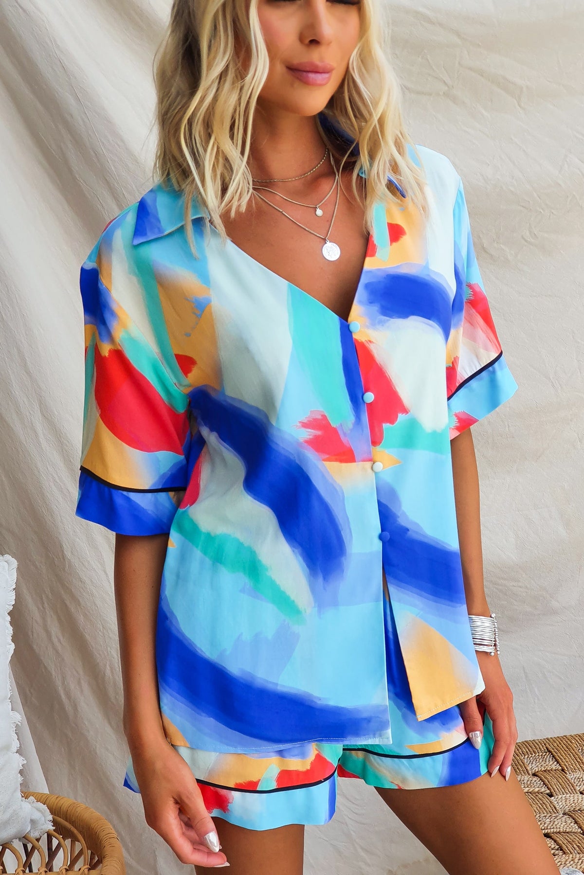 Colorful Focus Shirt in blue, red, and yellow print, featuring a relaxed fit and button-up front.