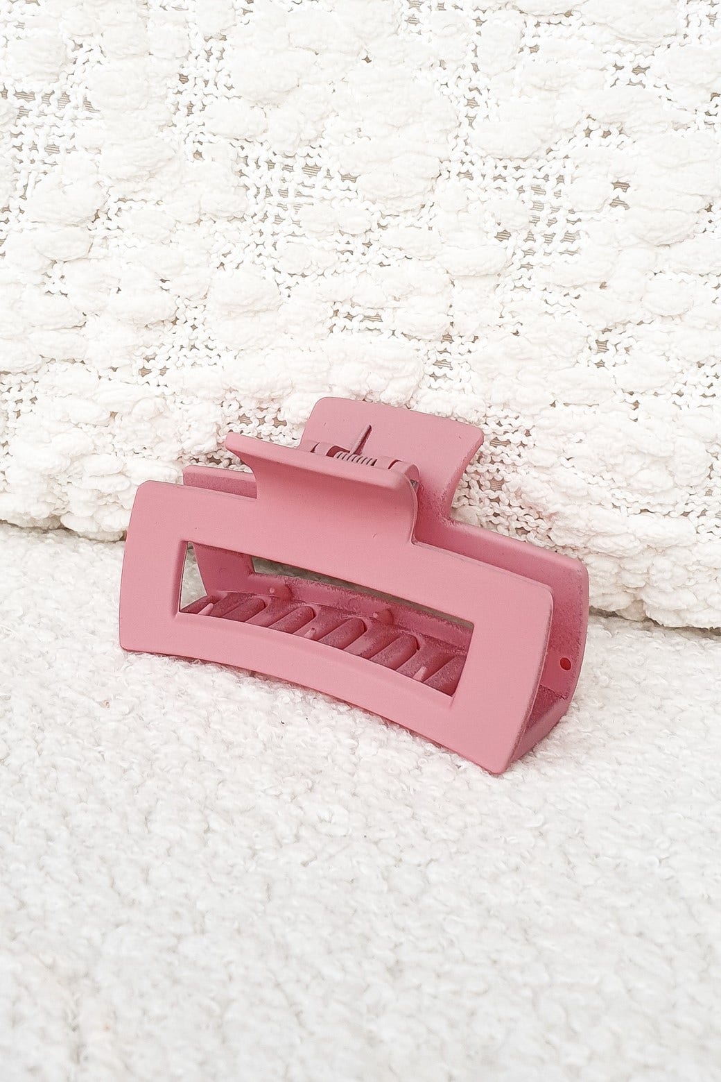 Emma Claw Clip in matte pink finish, measuring 8cm, ideal for stylish hair updos and secure styling.