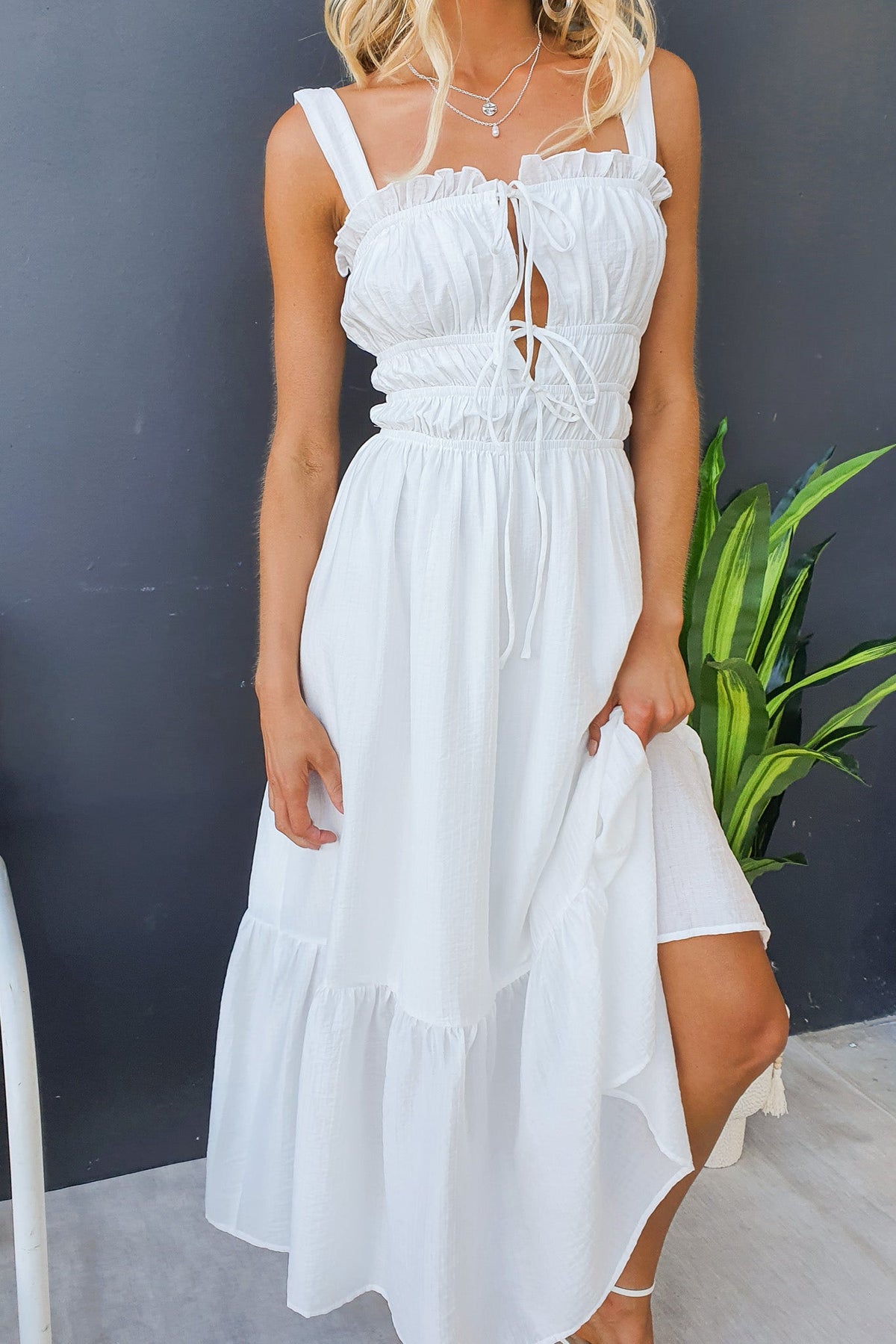 Shanina Midi Dress in white featuring tie details at bust and tiered hem, styled with layered necklaces.