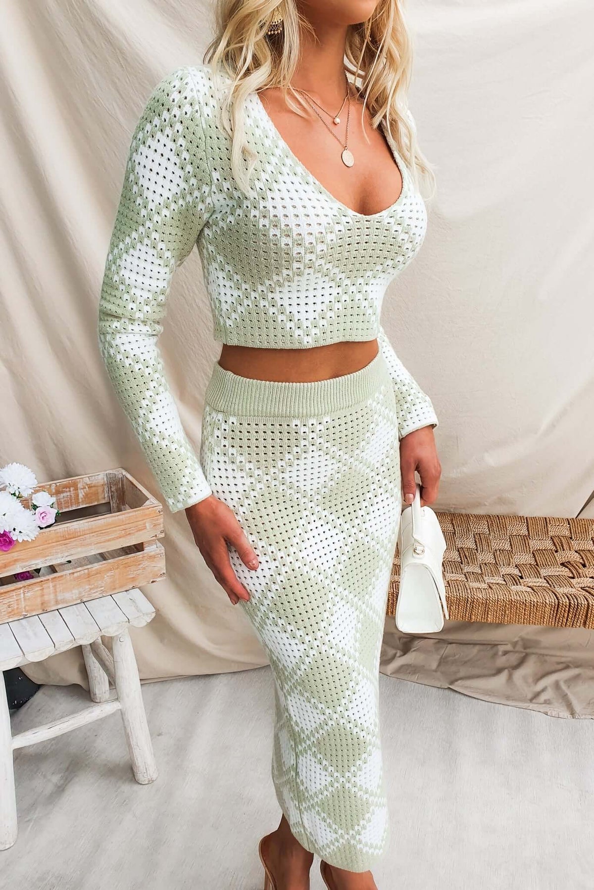 On My Own Set featuring a V-neckline knit top and mid-high waist maxi skirt in a semi-open weave design.