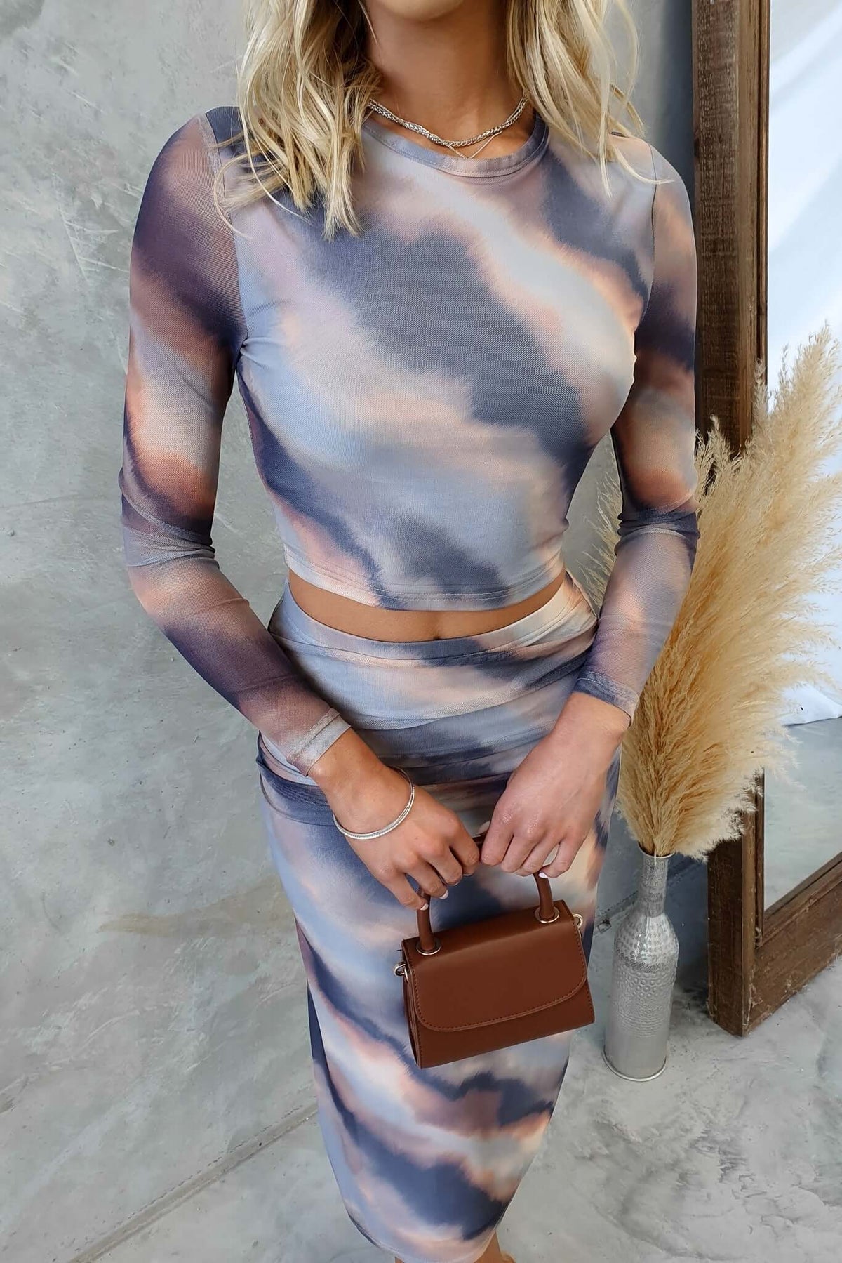 Stylish Crunch Time Set featuring a round neckline and midi skirt in soft mesh material, model wearing size XS.