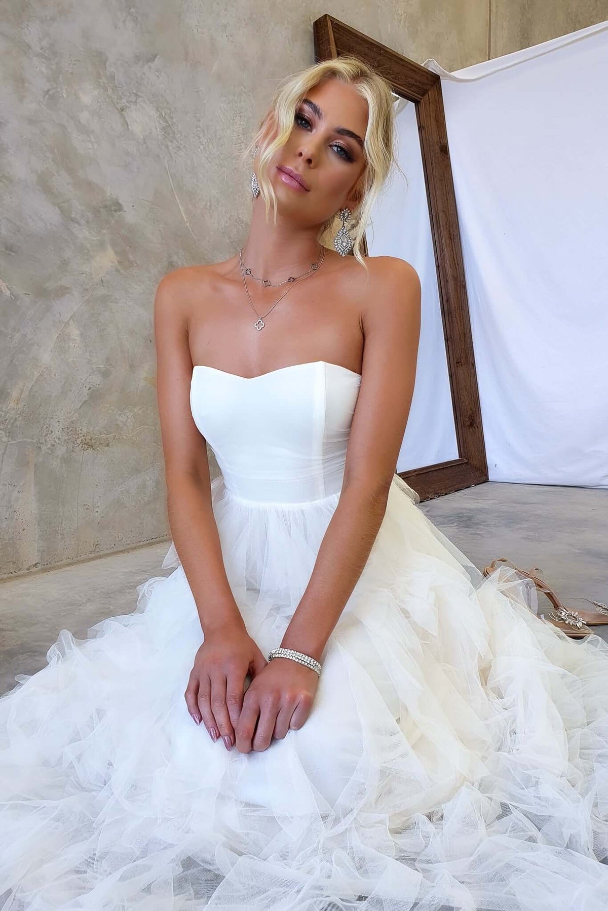 Strapless Carrie Maxi Dress with tulle overlay, showcasing a stylish fit and elegant design, perfect for special occasions.