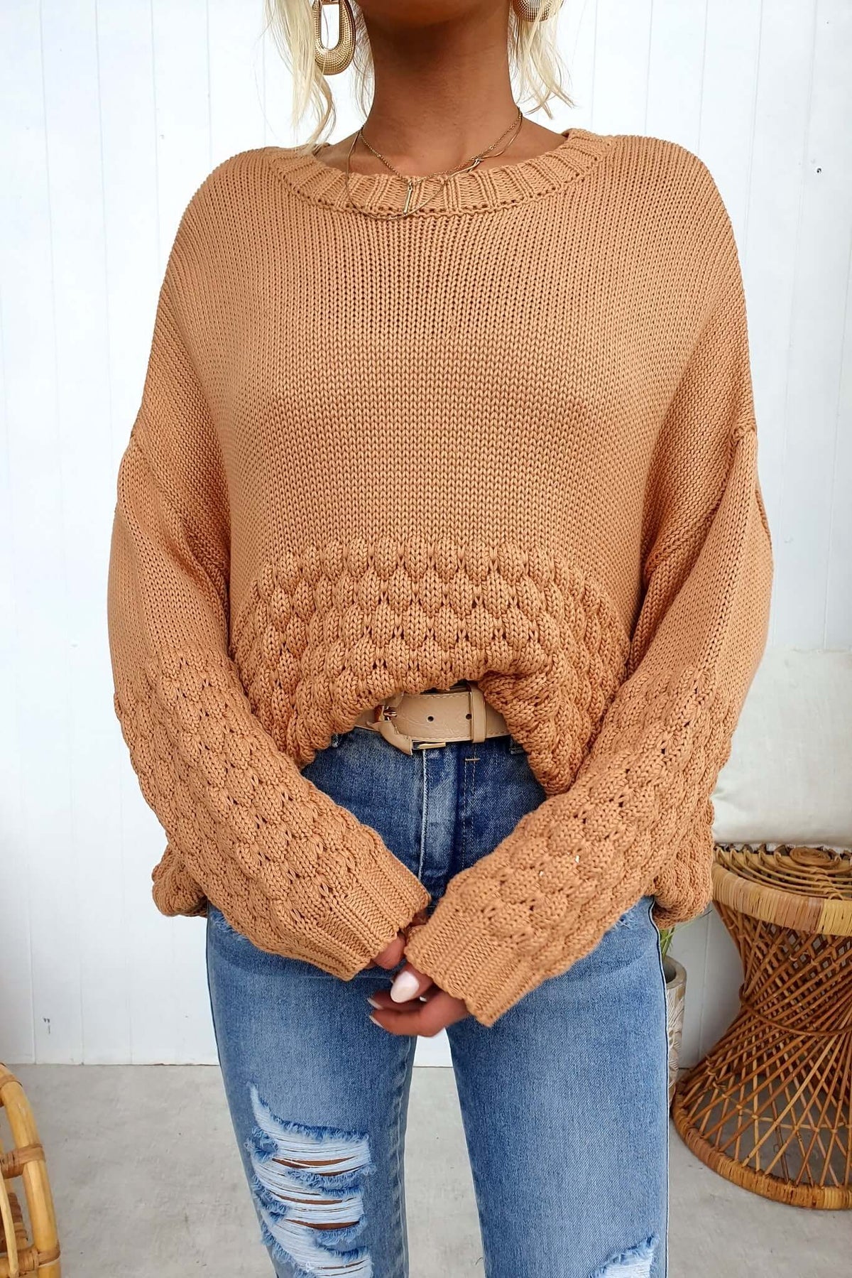 Woman modeling a stylish Hamden Jumper in warm tan, featuring a round neckline and textured knit design.
