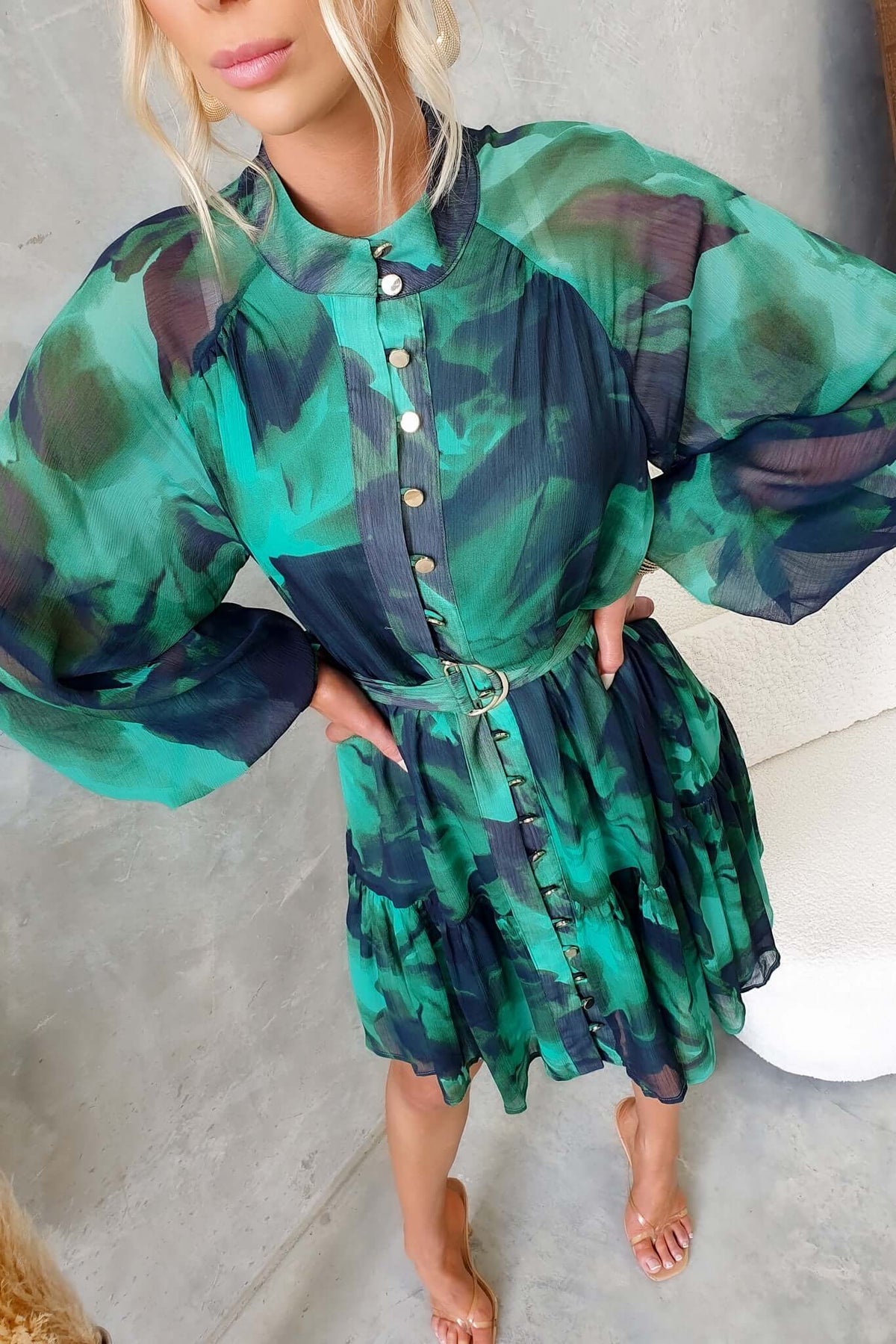 Orazio Dress featuring a high neckline, button-up front, and a removable belt in vibrant green chiffon.