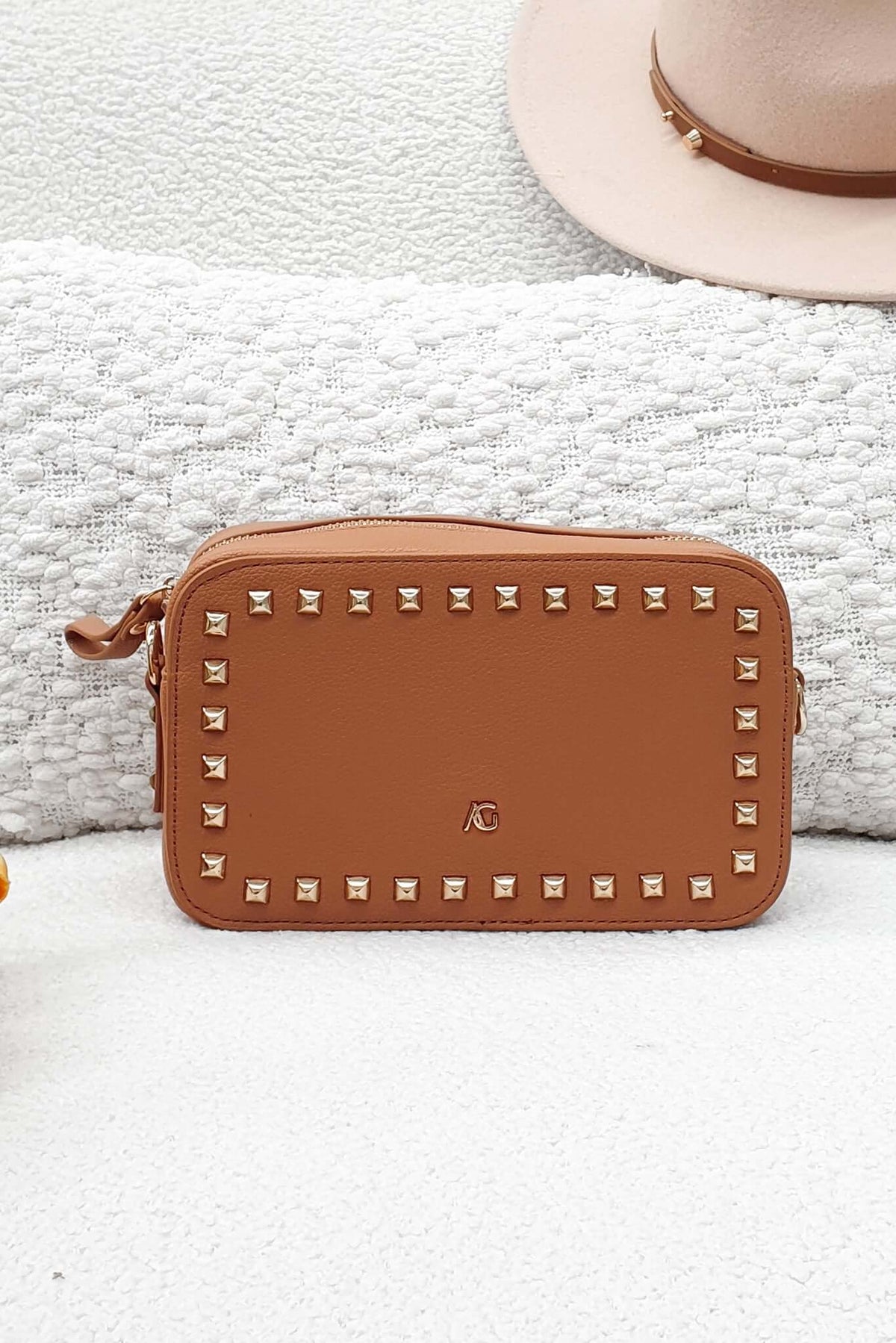 Stylish Veronica Crossbody Bag with metallic studs, perfect for essentials and a night out.