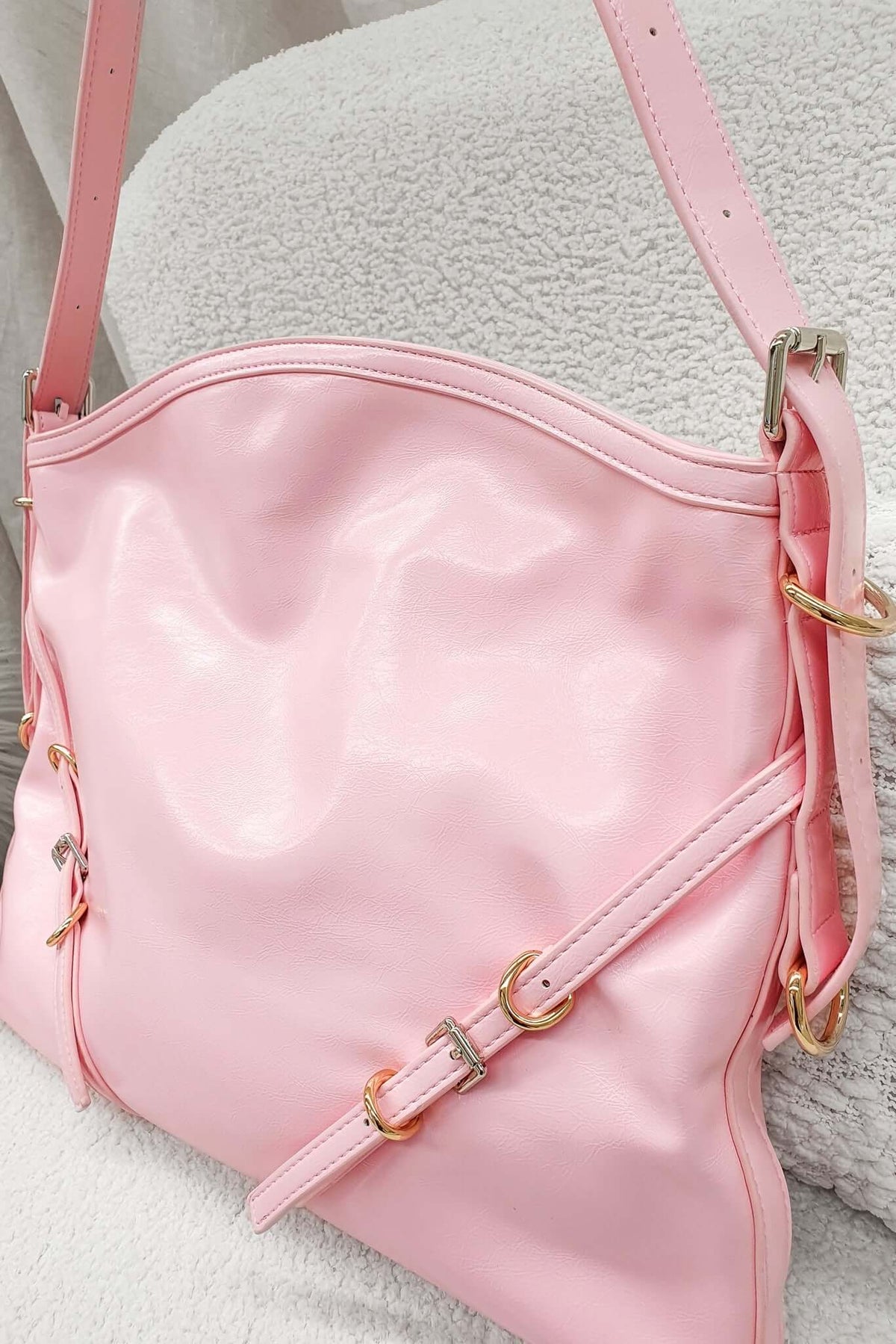 Stylish pink Bily Bag with gold hardware, perfect for everyday essentials and tote collection.