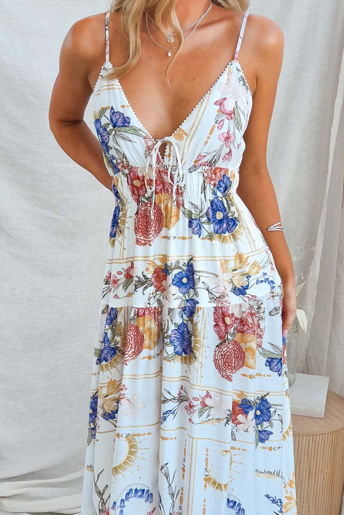 Garlyn Maxi Dress featuring adjustable straps, tie at bust, floral print, and a comfortable, lined fit.