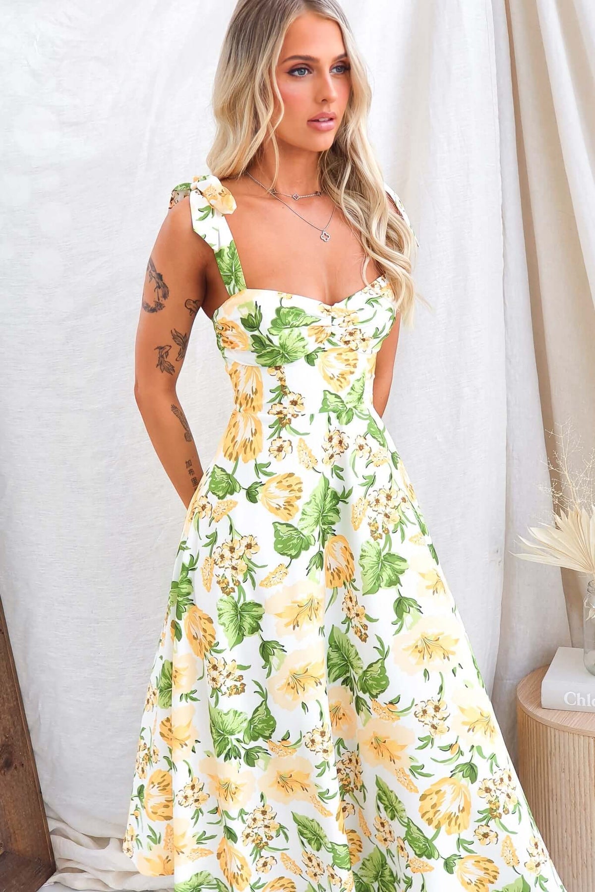 Floral print midi dress with adjustable tie straps and invisible zip, perfect for warm weather attire.