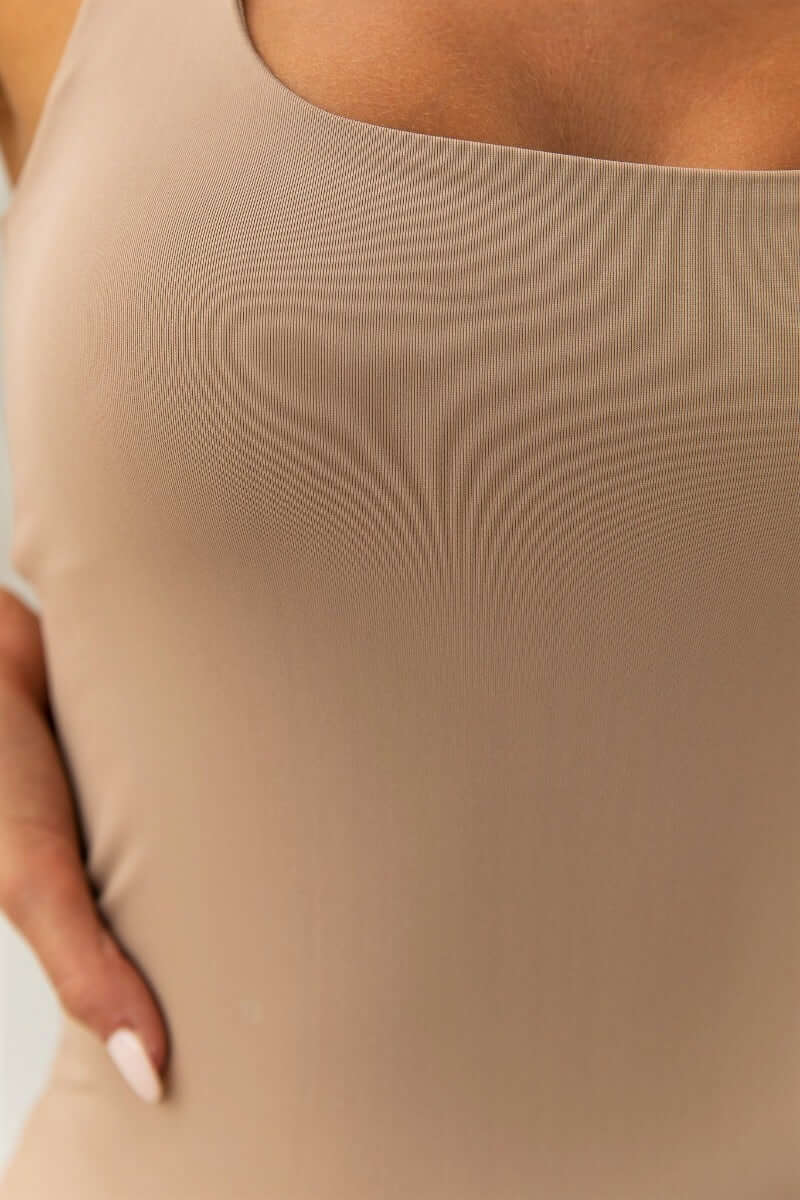 Close-up of Layla Top showing the wide scoop neckline and soft Lycra feel fabric in a beautiful beige shade.