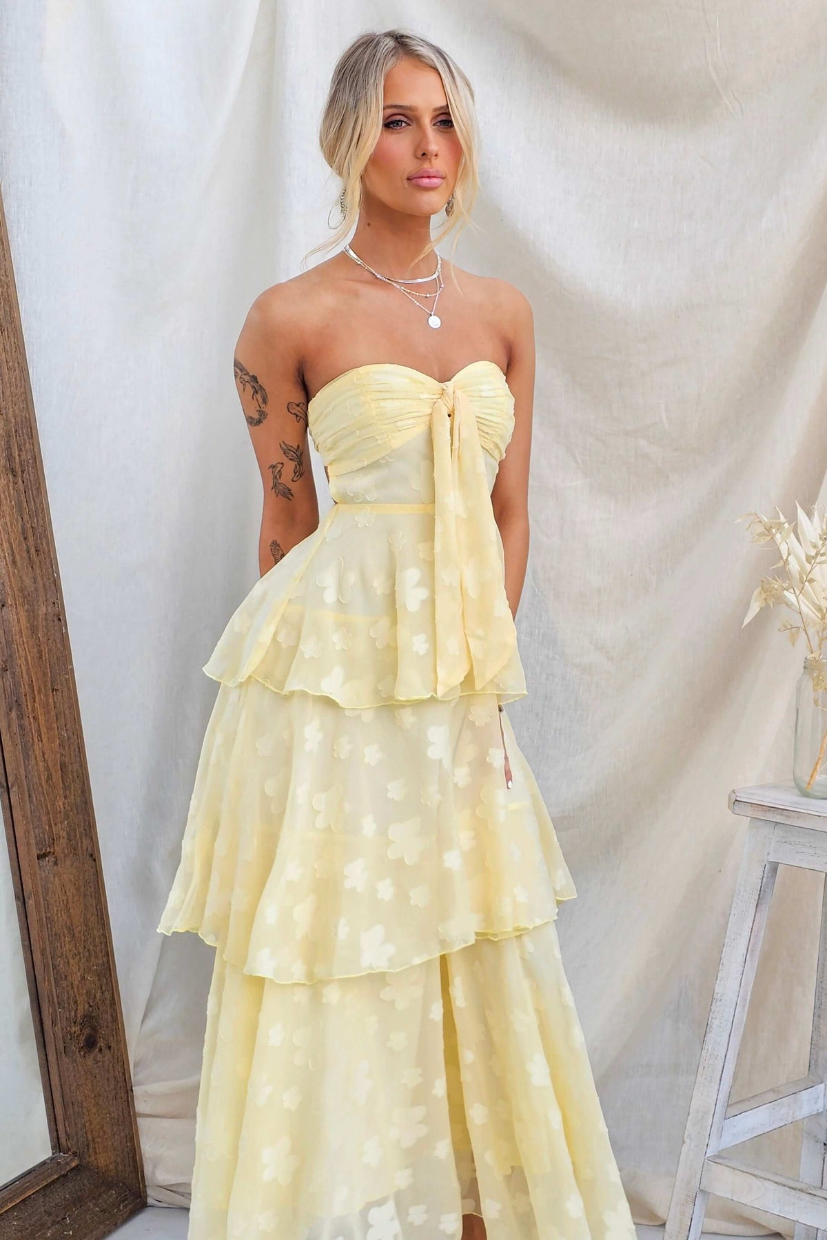 Soft Whispers Maxi Dress in yellow with a tiered ruffle skirt and strapless design, perfect for summer occasions.