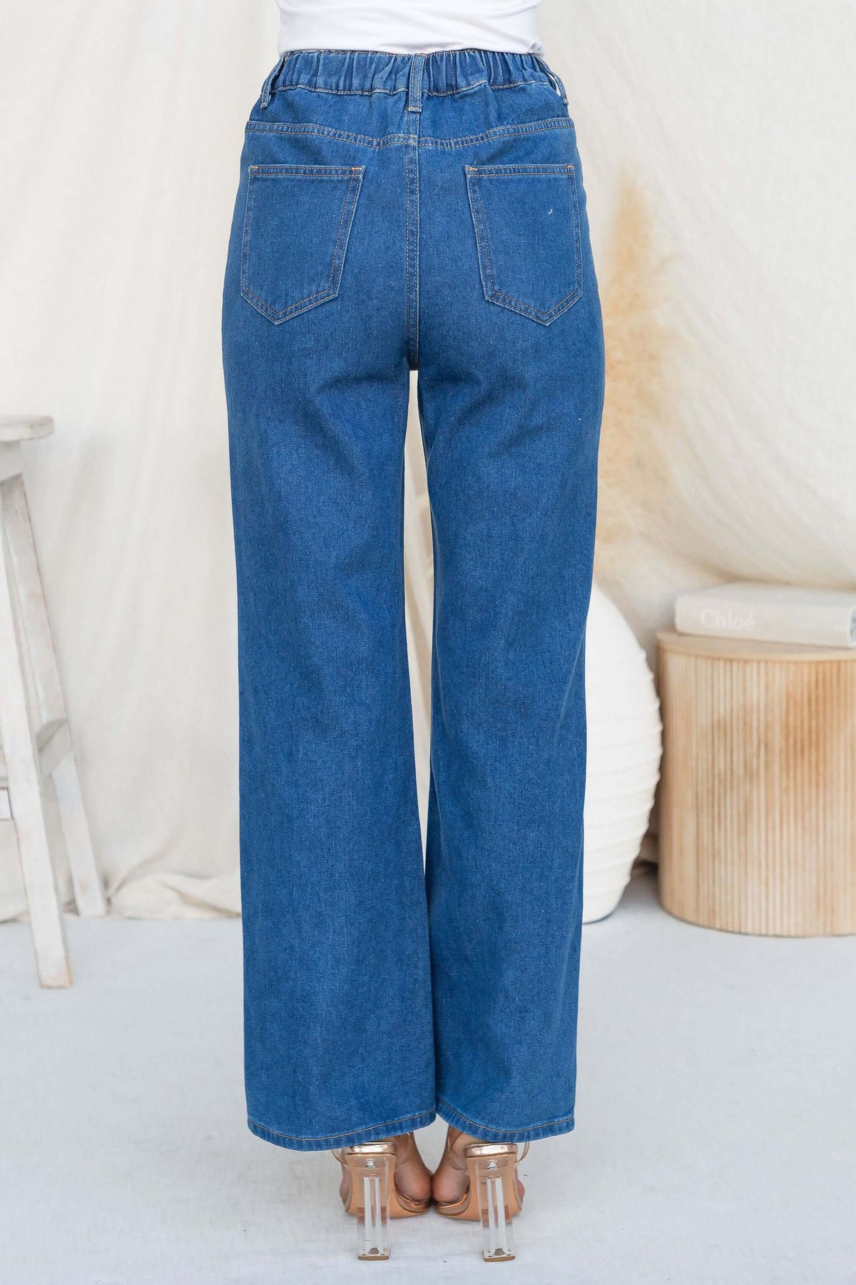 Back view of Roman Jeans featuring high waist fit and elastic waistband, showcasing two back pockets.