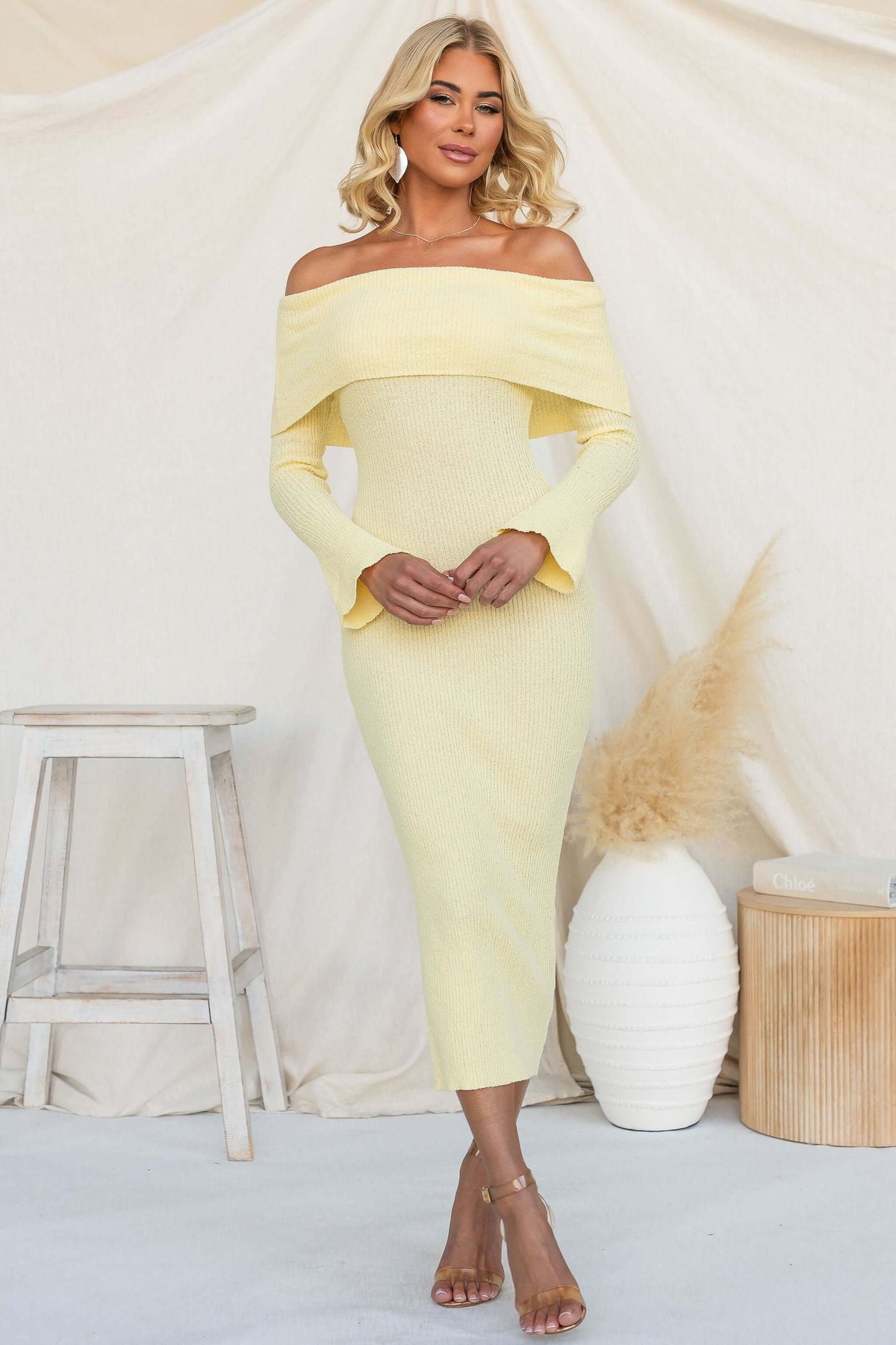 Breeze Midi Dress in soft yellow with off-shoulder neckline and ribbed knit material.