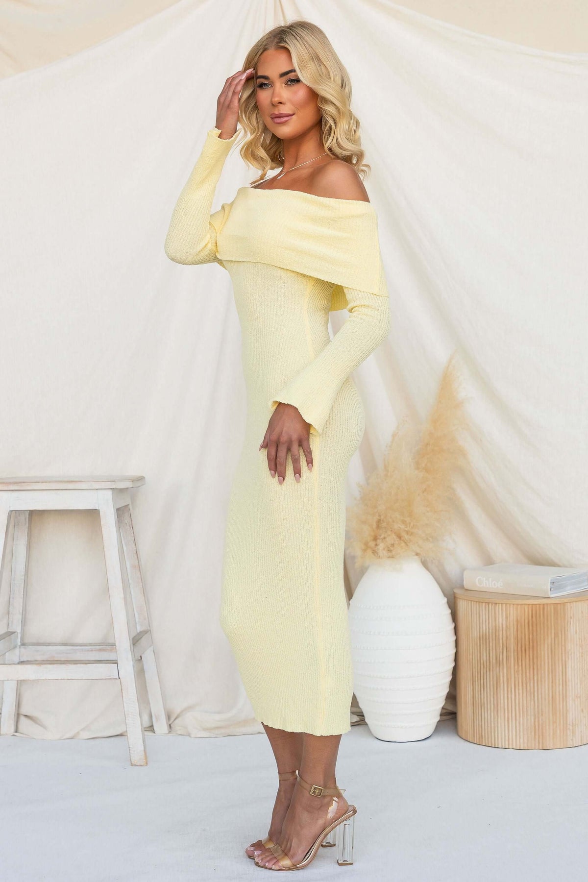 Breeze Midi Dress in soft yellow with off-shoulder neckline, perfect for warm weather styling.