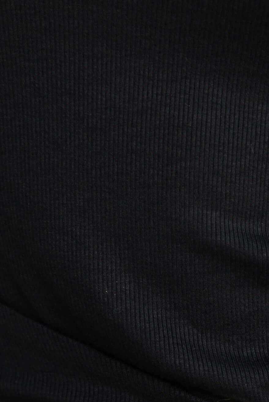 Close-up of ribbed material of the Manor Top in dark color, showcasing texture and stretch.