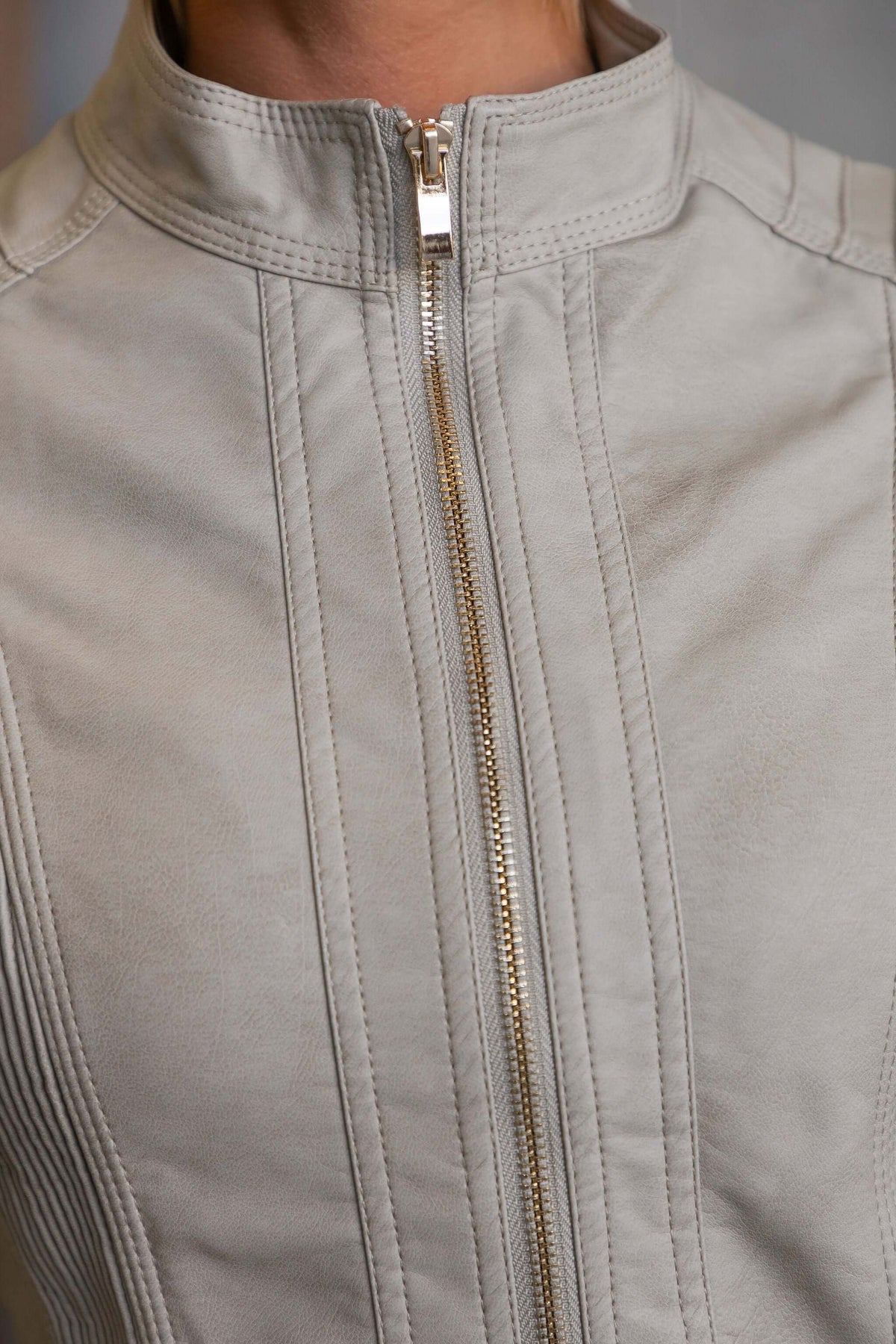 Close-up of the Are You Ready Jacket featuring a zip-up front and faux leather detail.