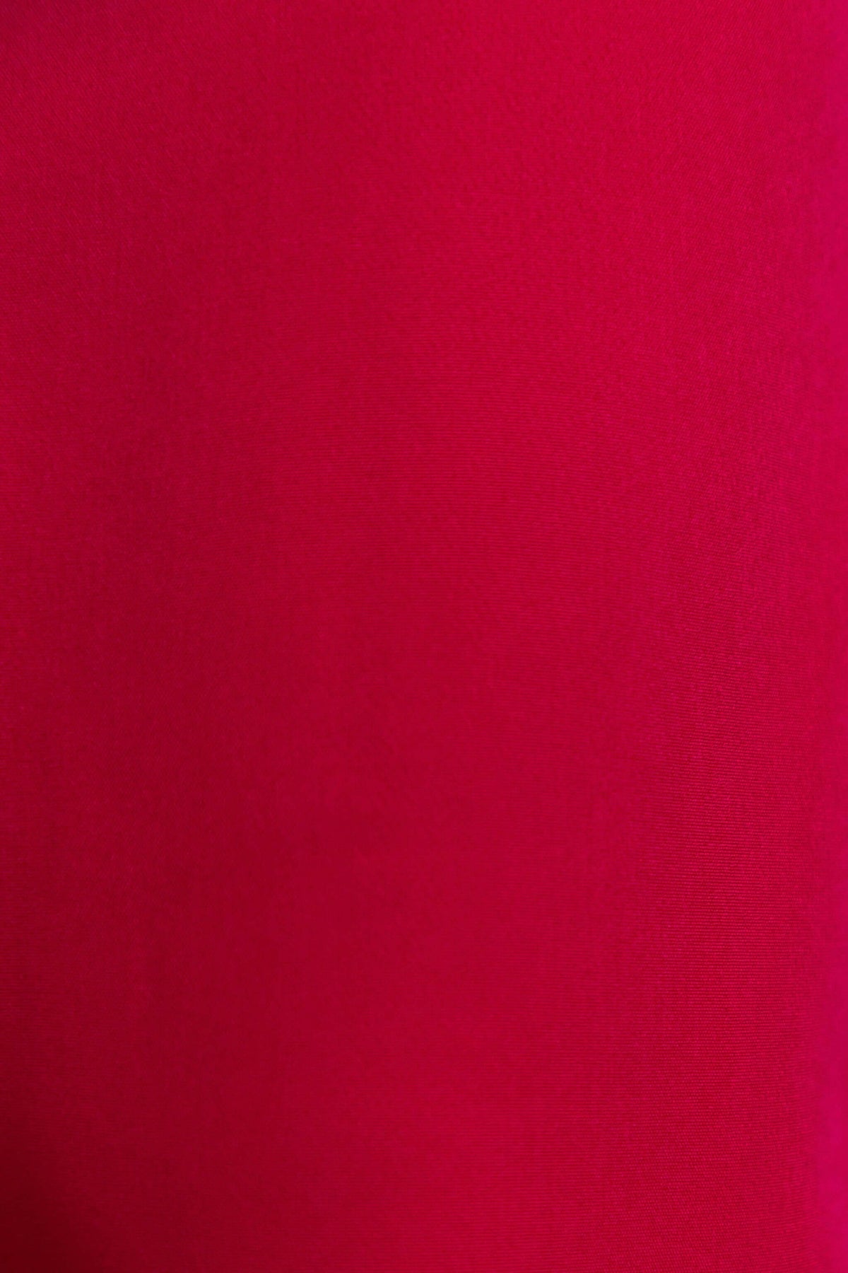 Close-up of the fabric texture in a rich red color of the Duchess Maxi Skirt.