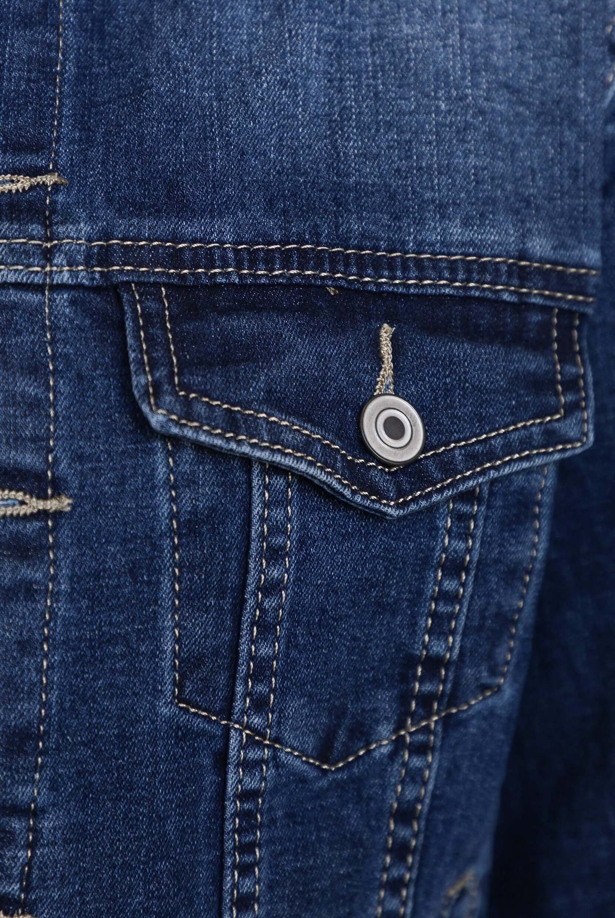 Close-up of Coyote Denim Jacket pocket detail showcasing classic denim texture and button.