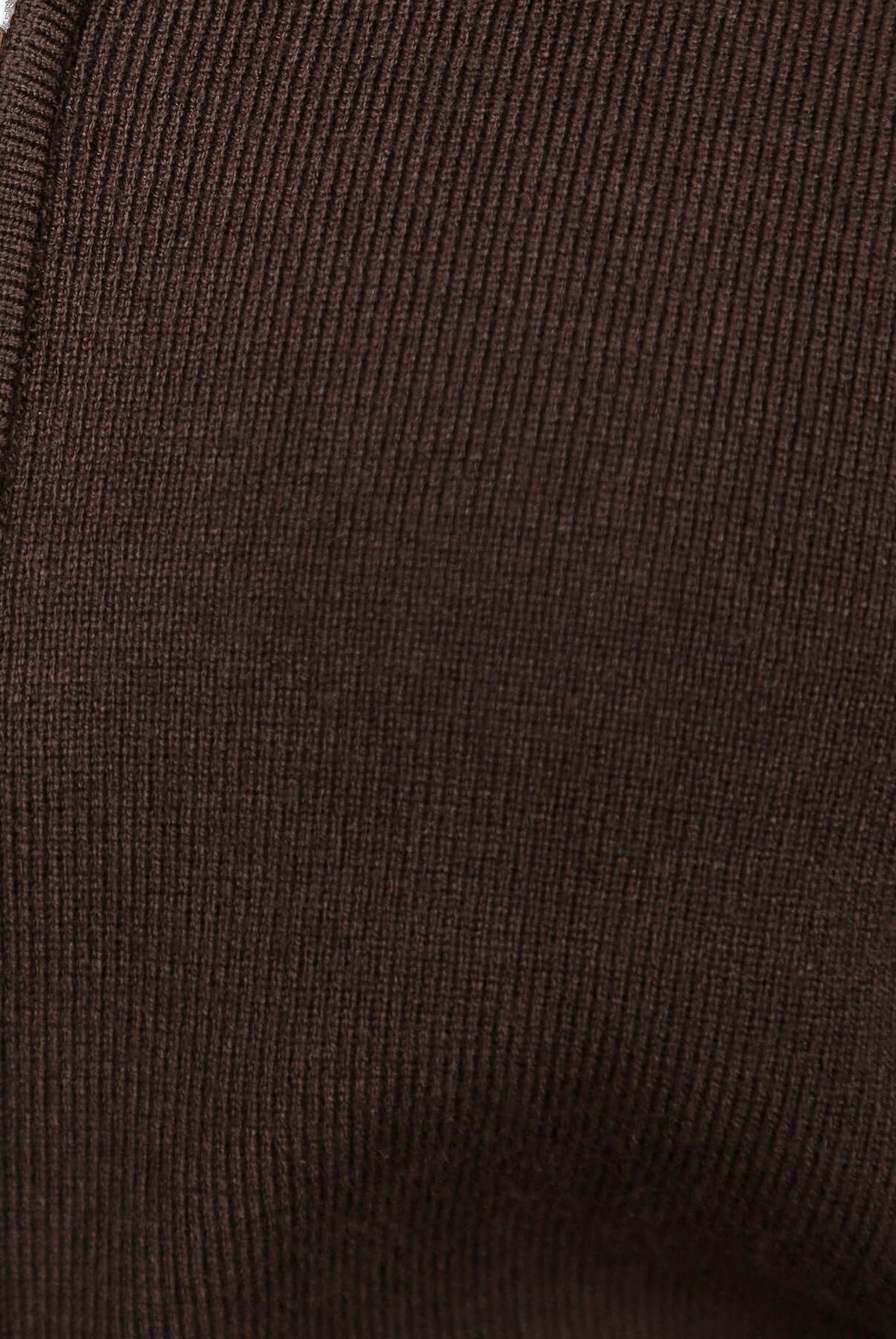 Close-up of ribbed knit material in dark brown for Grand Top fashion item.