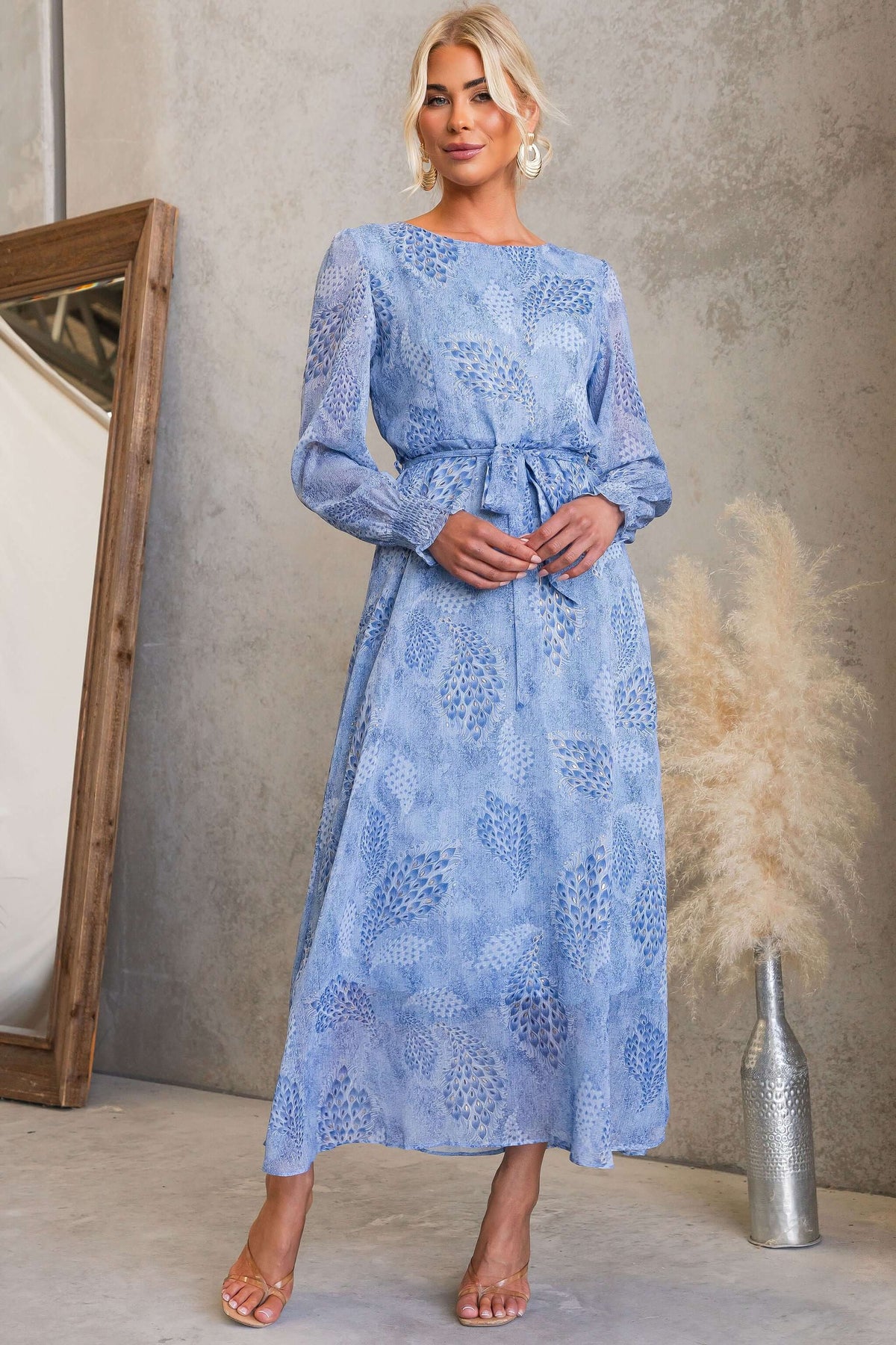 Taylah modeling the Morning Light Maxi Dress with blue floral print and removable tie.