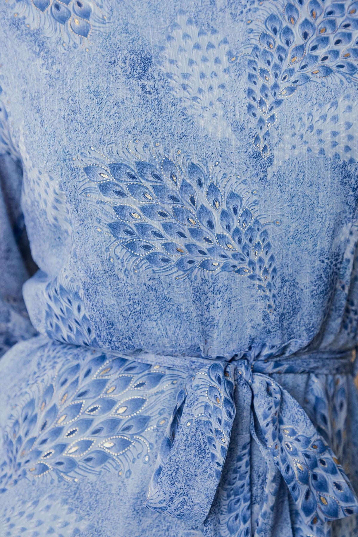 Morning Light Maxi Dress close-up showing blue fabric with decorative pattern and removable tie.