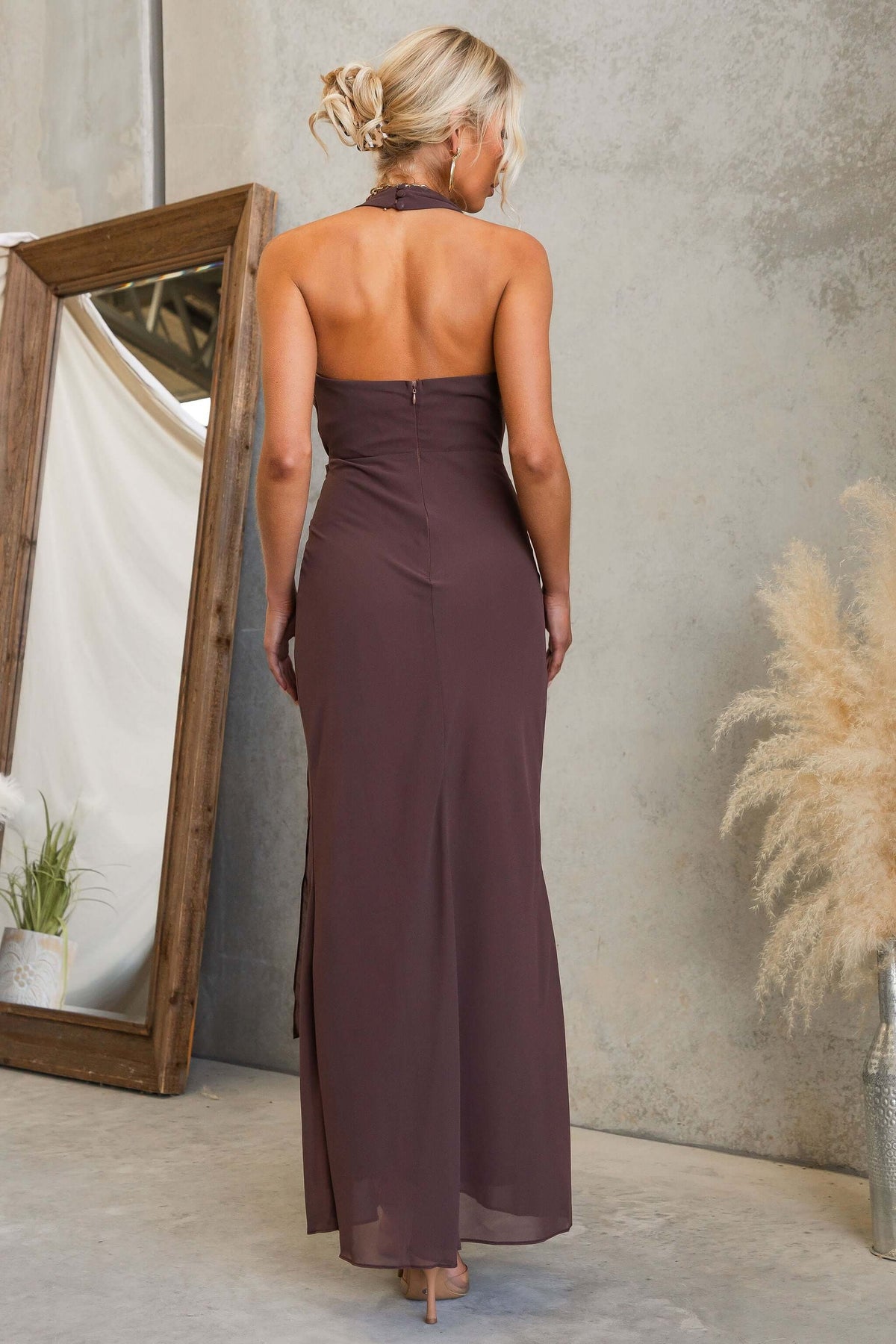 Back view of the Valmont Maxi Dress showcasing its halter neckline and flowing chiffon material.