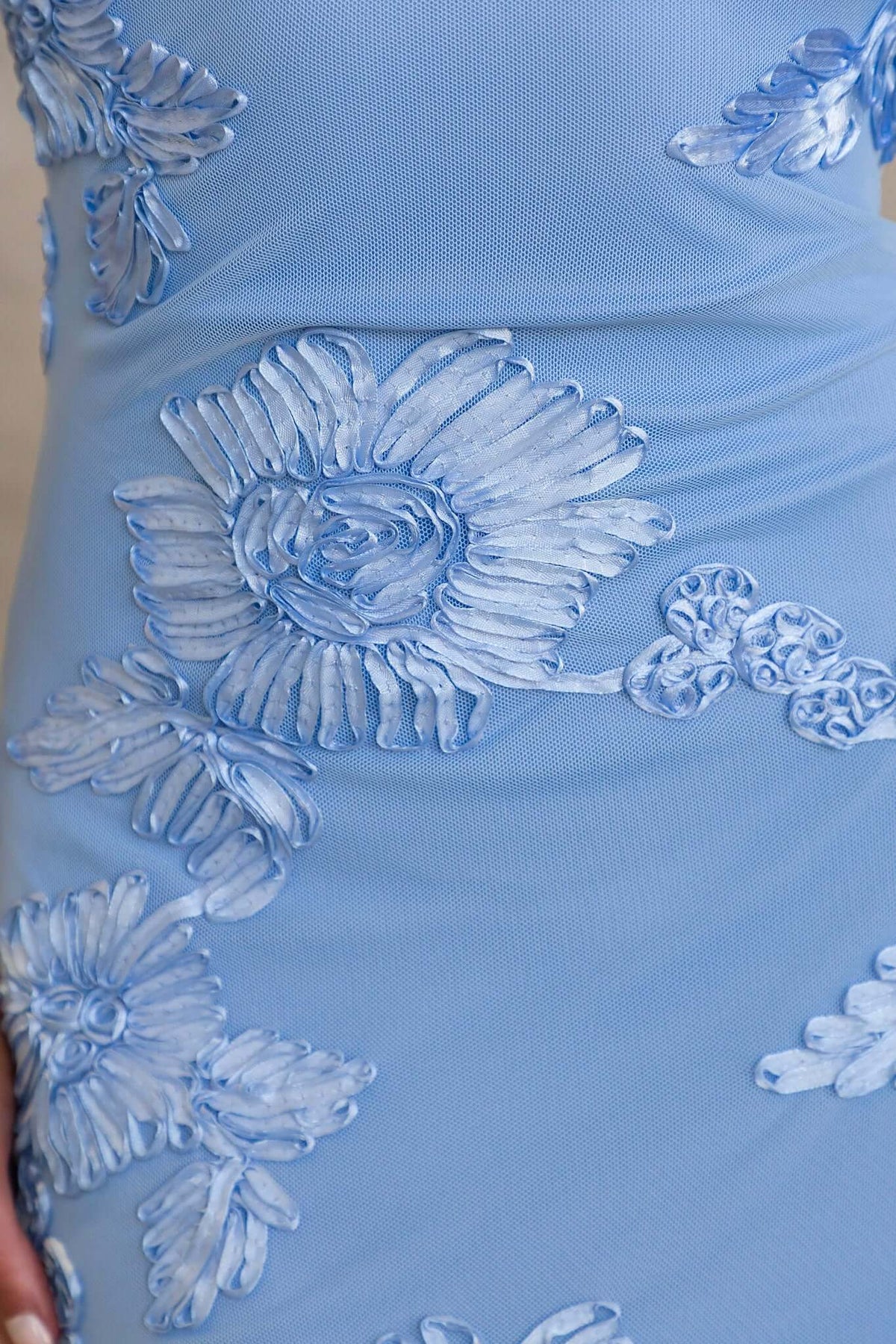 Korren Maxi Dress with intricate embroidered mesh floral design in soft blue, showcasing elegant detailing.