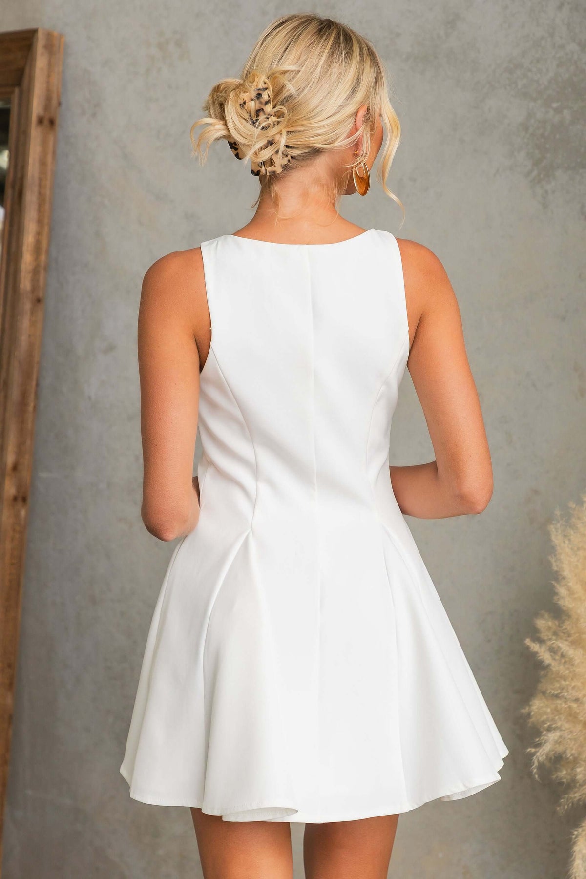 Back view of The Signature Dress showcasing its elegant design and fit.