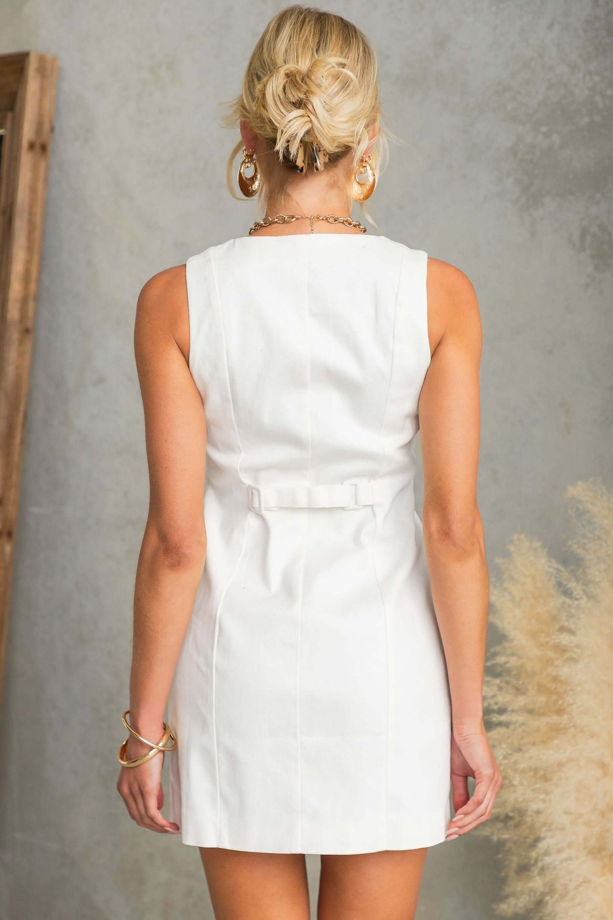 Back view of the Sunday Rise Dress showcasing its sleek design and adjustable strap.