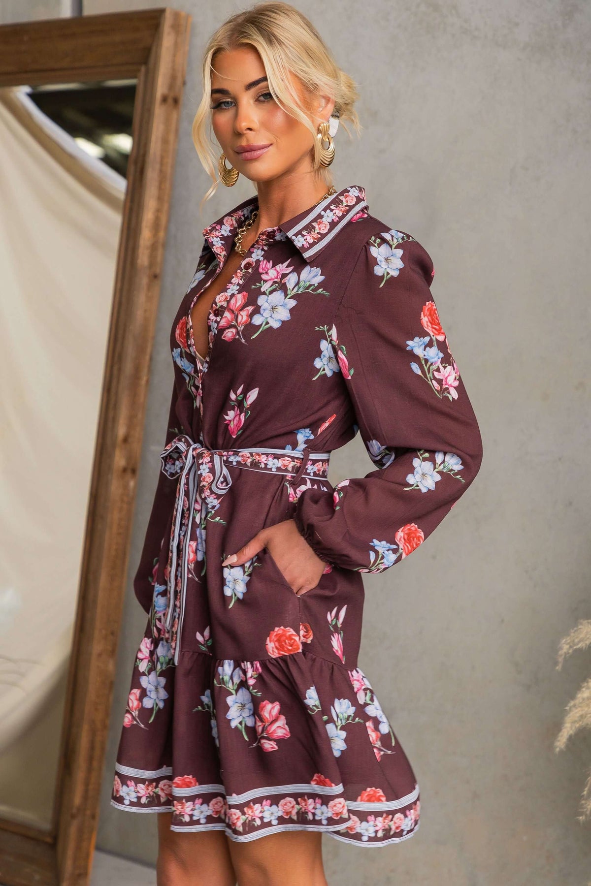 Fergy Dress with floral design, collar, button-up front, and removable tie styled for a casual look.