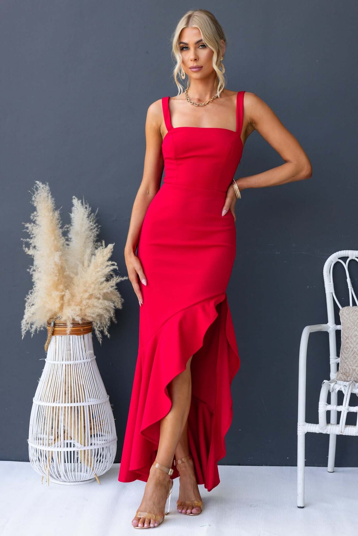 Acoma Maxi Dress in vibrant red with adjustable straps and a high slit, perfect for any occasion.