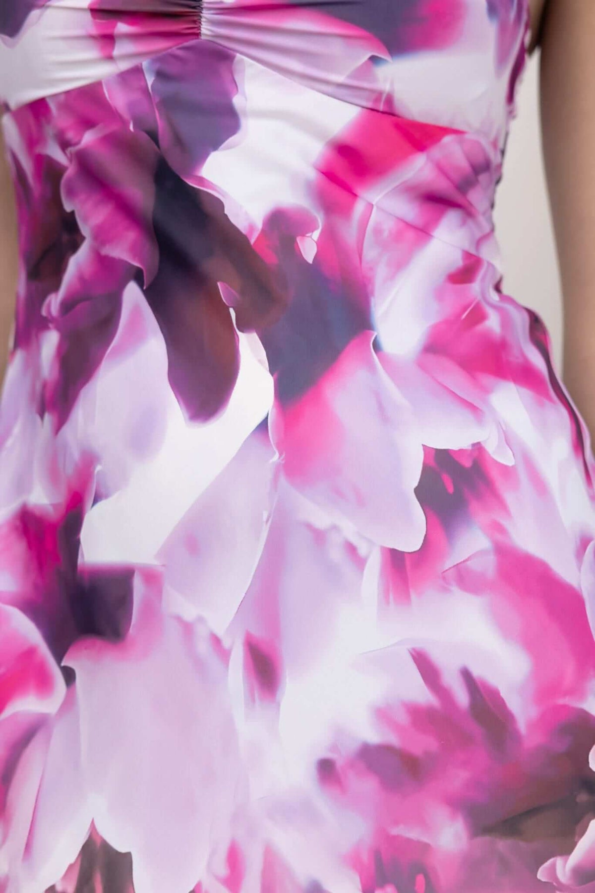 Close-up of floral design on Kasian Maxi Dress, featuring vibrant pink and purple hues for an elegant look.