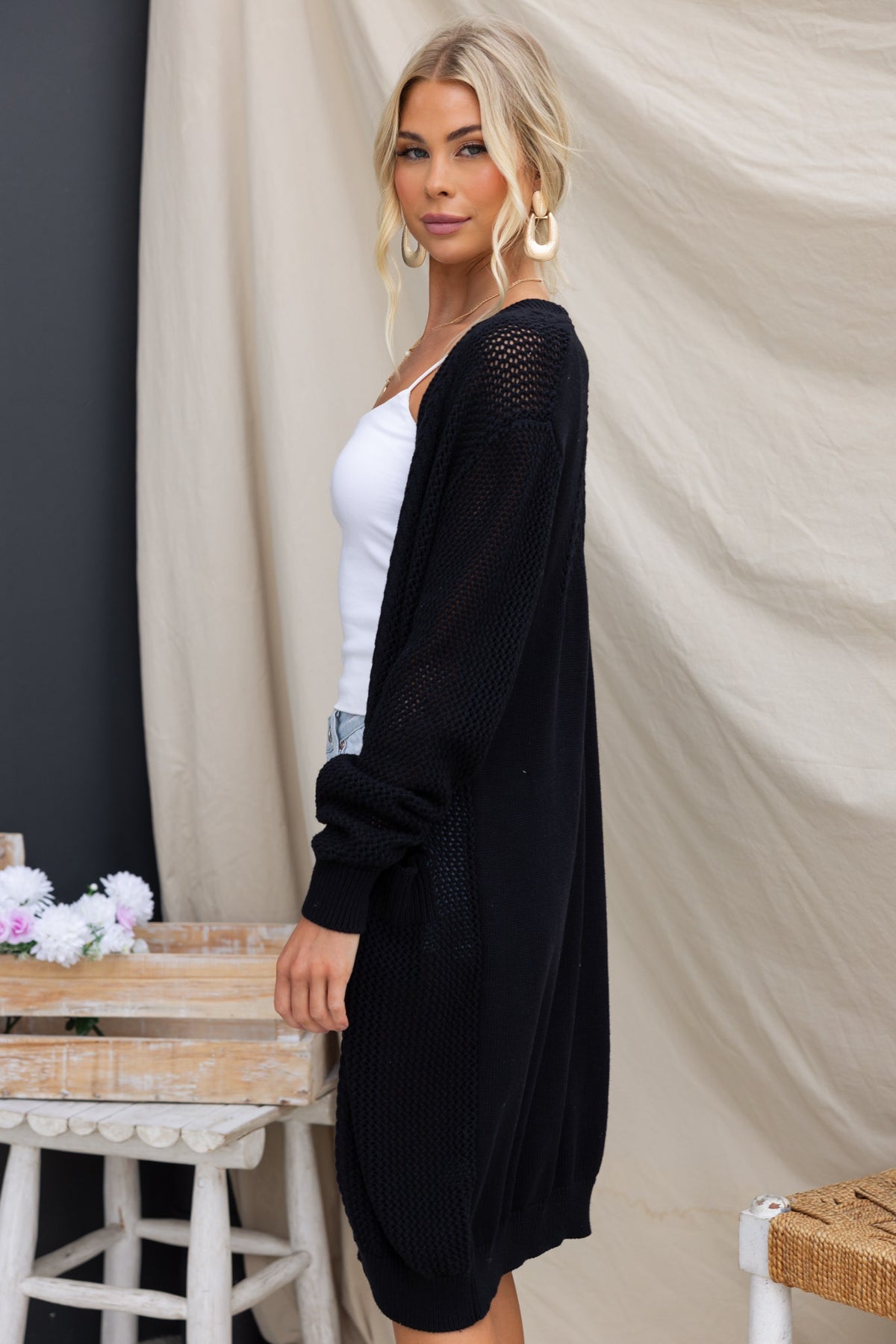 Black Lorendo cardigan featuring longline fit, pockets, and relaxed style, perfect for casual outfits.