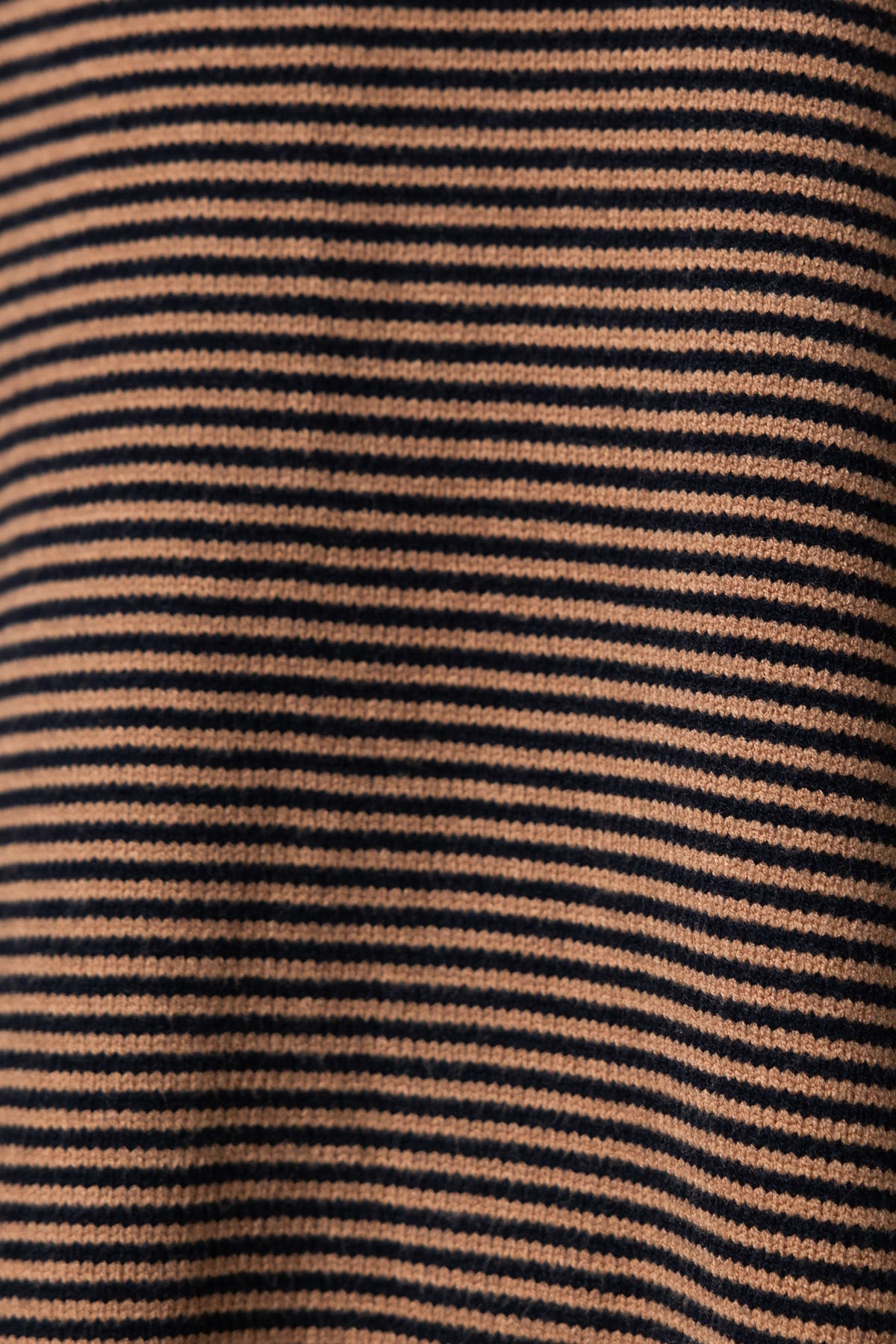 Close-up of striped fabric in beige and navy for Journey Jumper, featuring a soft texture and stylish pattern.