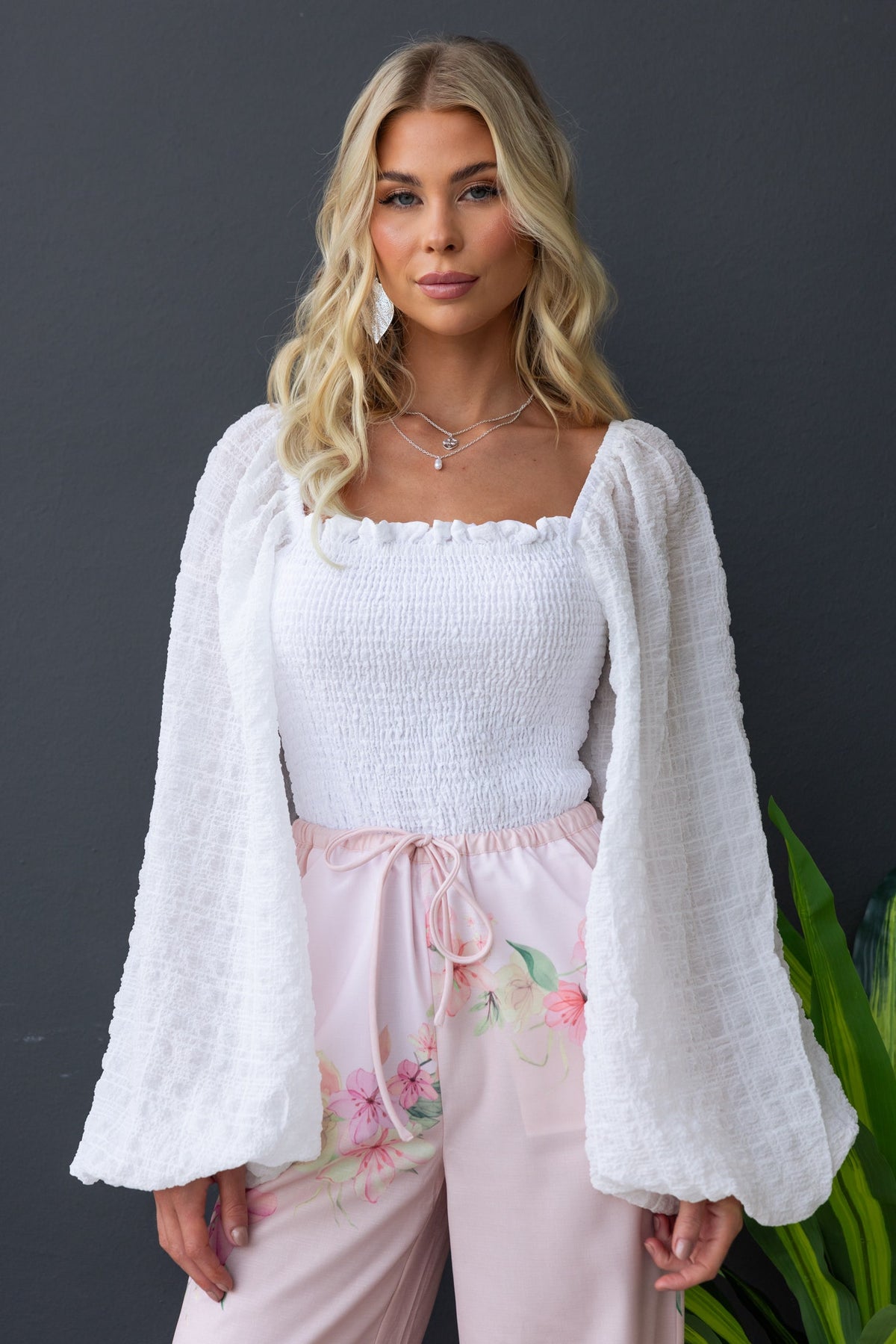 Joey Top featuring a square neckline, elastic bodice and bell sleeves in textured white fabric.