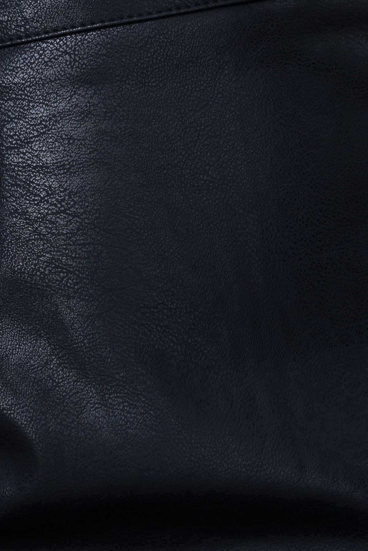 Close-up of textured black faux leather, highlighting the fabric detail of the Indah Skirt.