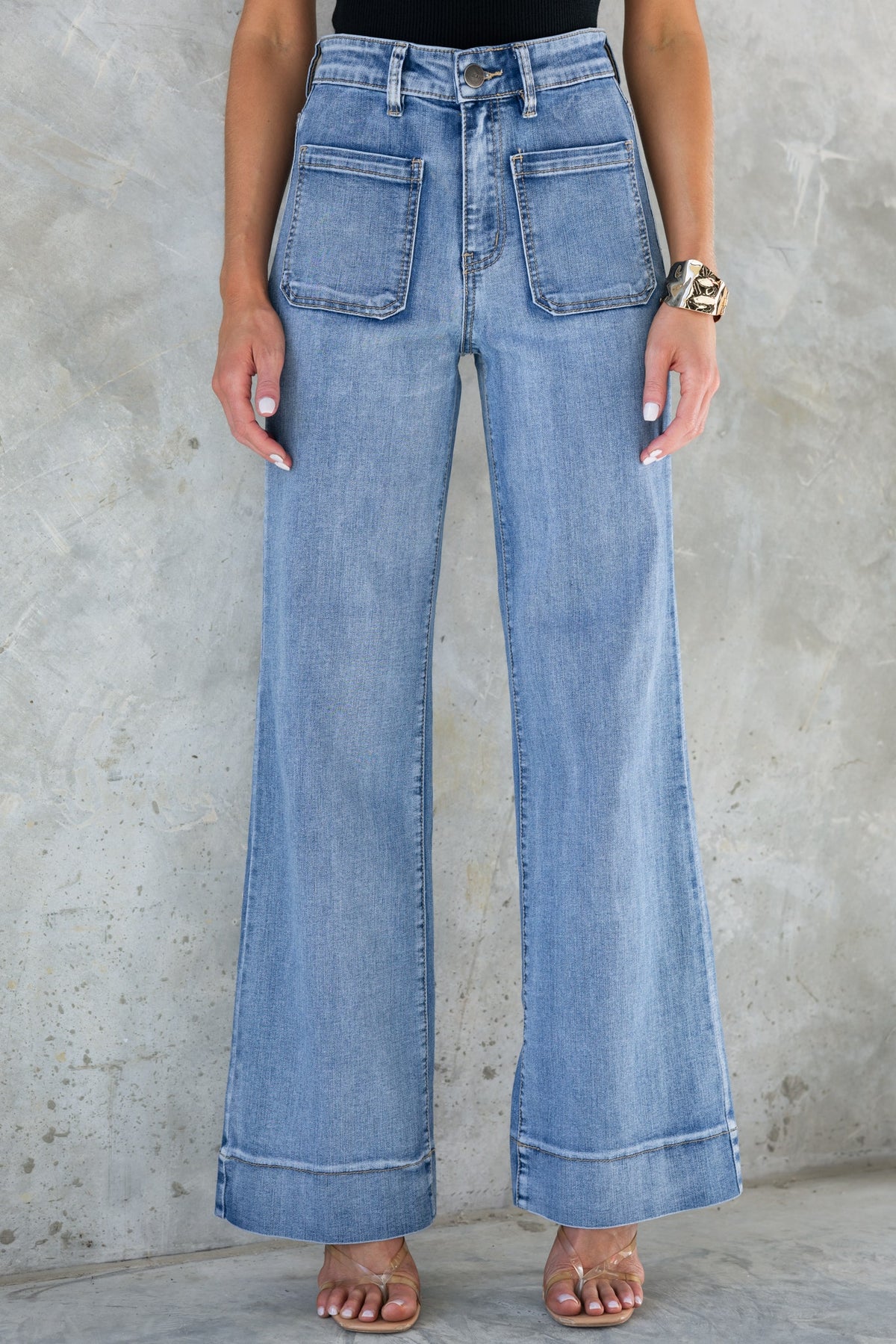 Damon Jeans featuring a mid-high waist, straight leg fit, and front & back pockets in a classic blue denim.