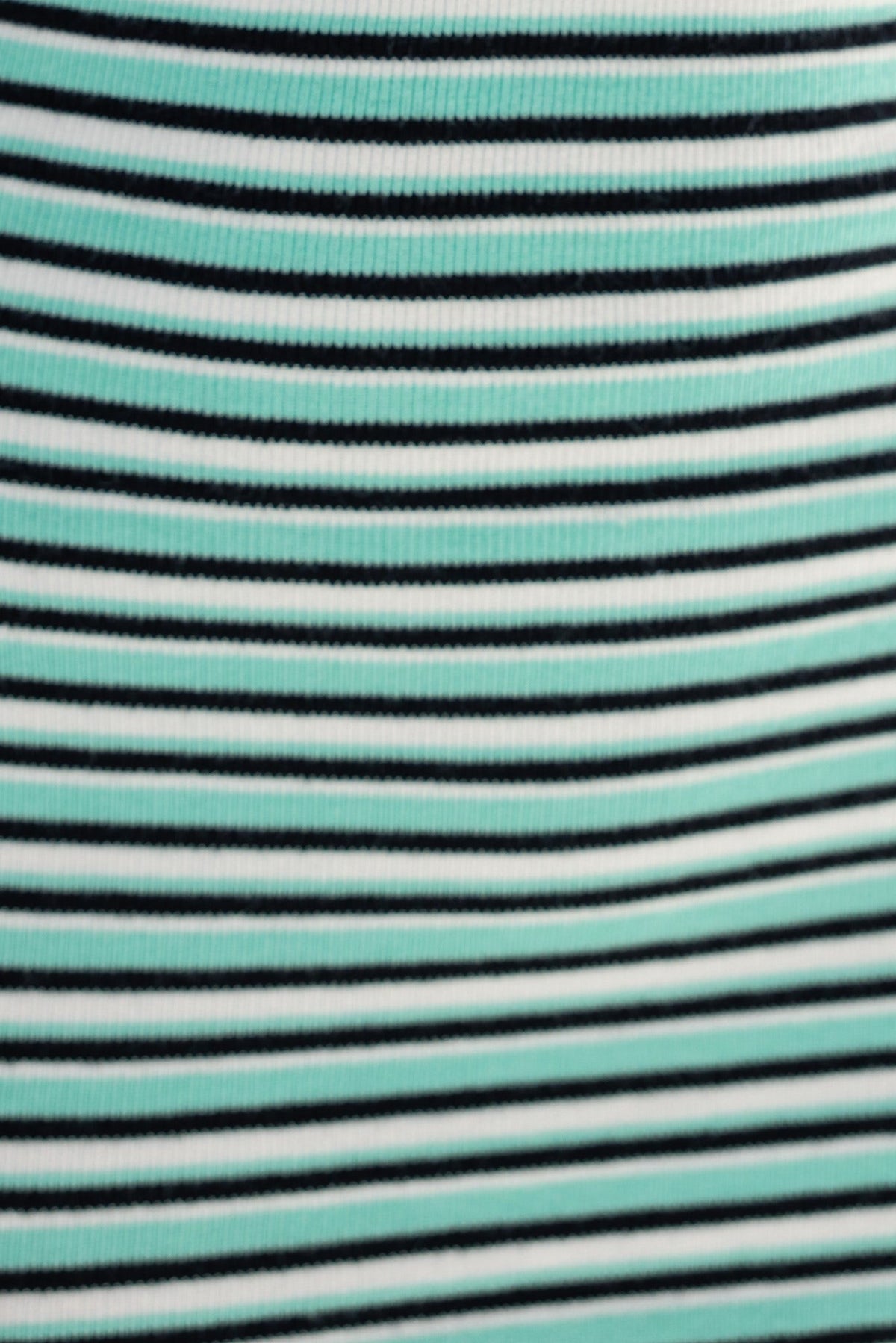Close-up of teal and black striped knit fabric, showcasing a stretchy design ideal for stylish clothing.