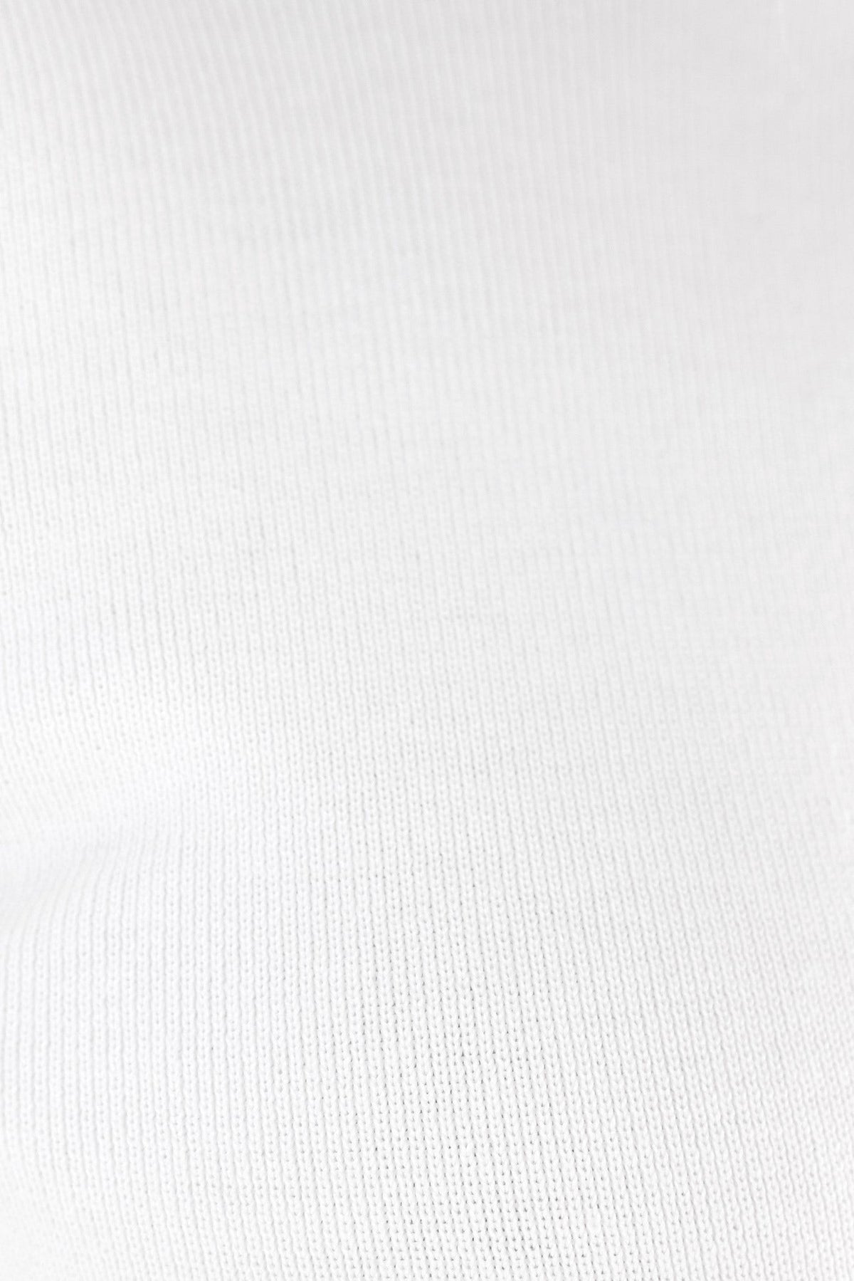 Close-up of soft white knit fabric showing texture, ideal for a comfortable fit in the Sania Top.
