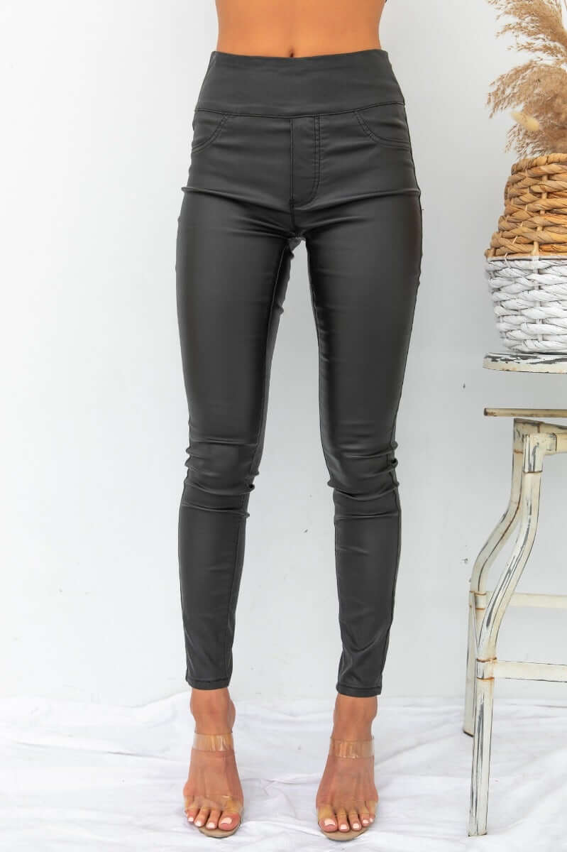 Damar Pants: Women's wet look pants with faux pockets, firm stretch fabric, perfect for a stylish outfit.