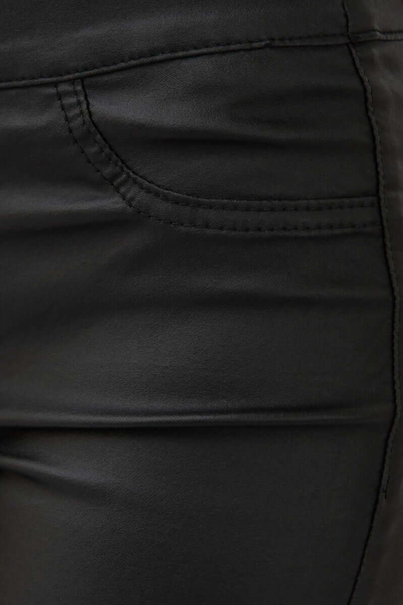 Close-up of Damar Pants showcasing the wet look texture and faux front pocket detail.