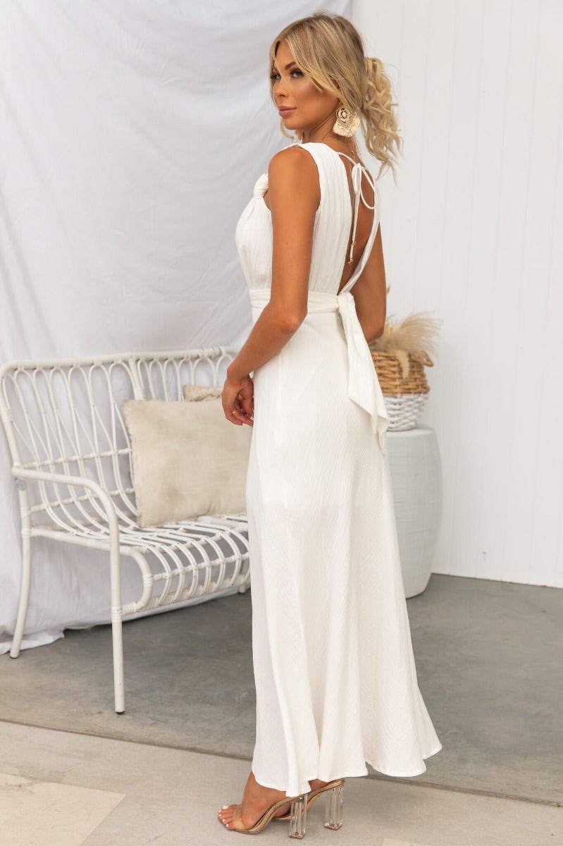 Gia Maxi Dress in textured white cotton with tie back detail and flowing silhouette.