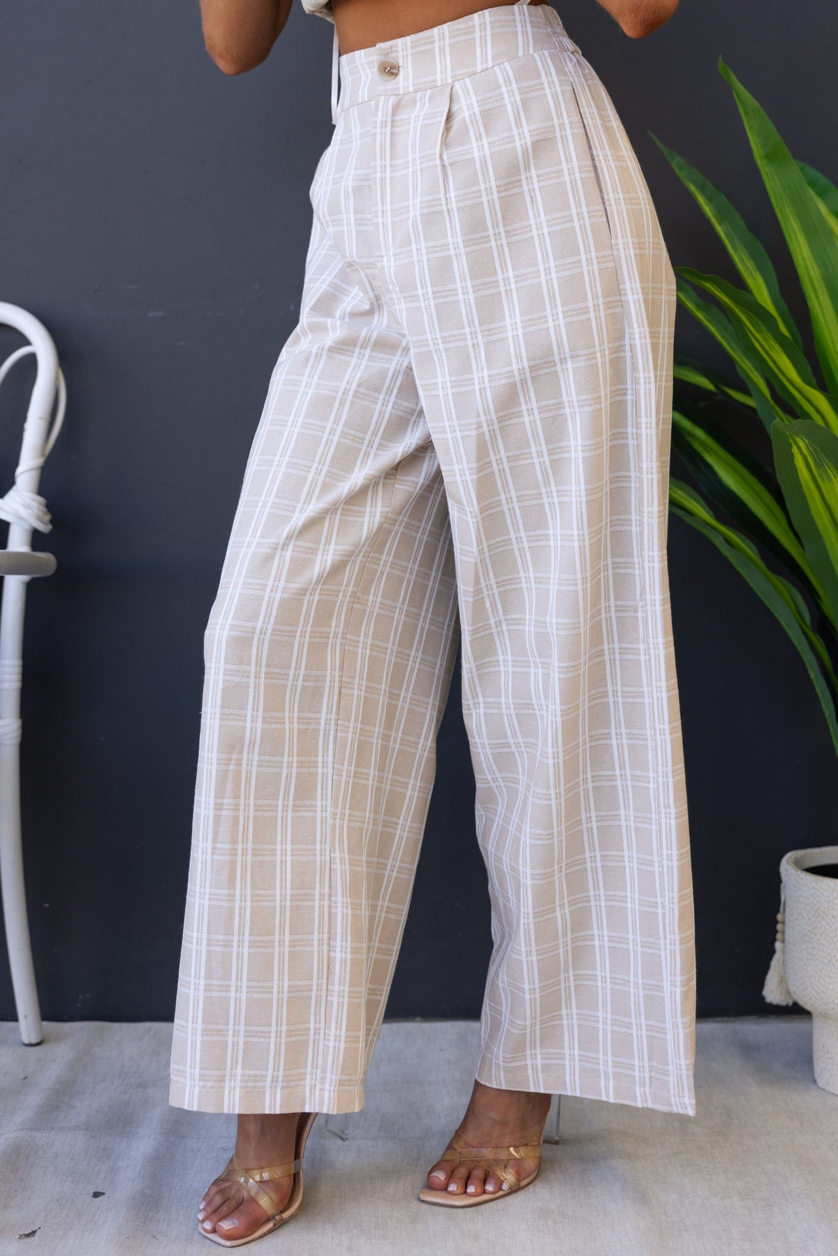 Bexley Pants in beige plaid, featuring a mid-high waist, elastic back, and wide-leg fit for comfort and style.