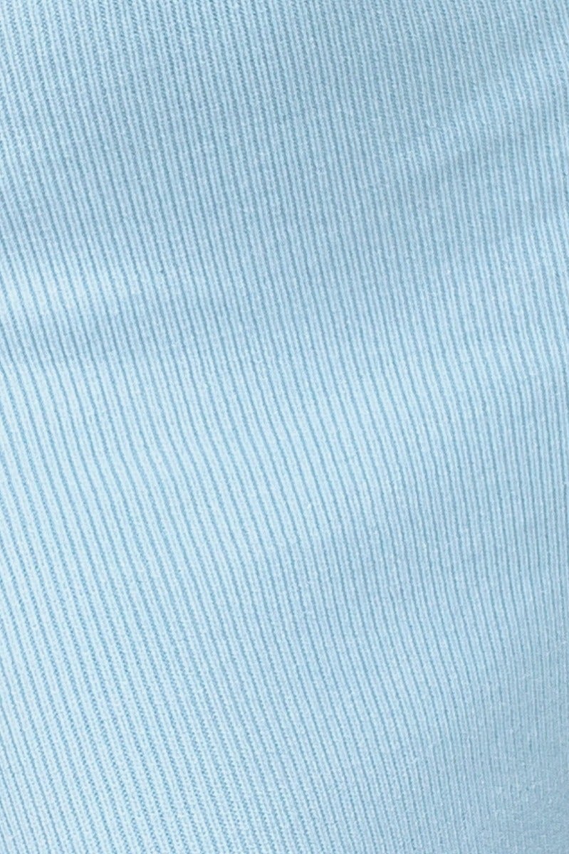 Close-up of soft, light blue ribbed knit fabric, showcasing texture for Xion Midi Dress made of 75% polyester and 25% acrylic.
