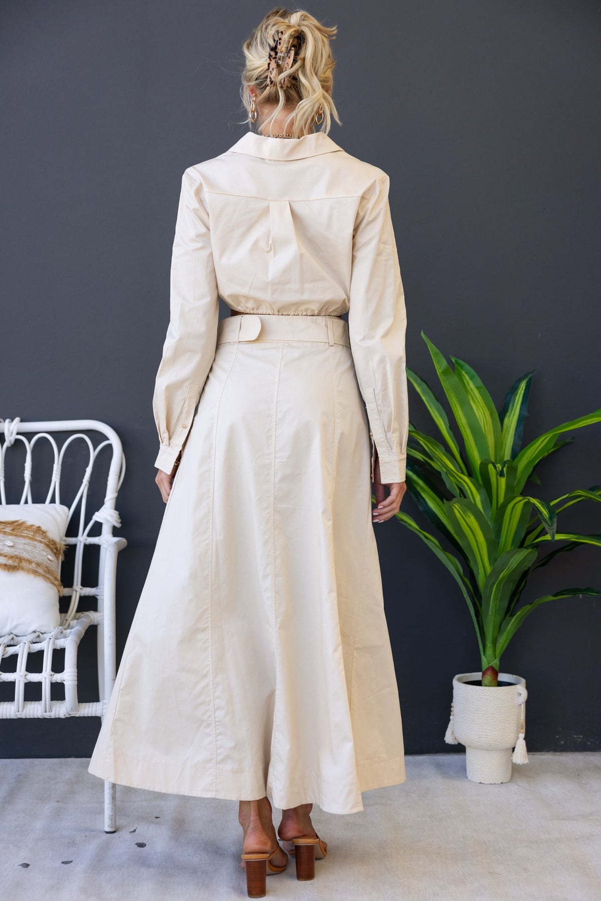 Back view of the Crave Set featuring a collared shirt and a maxi skirt with a removable belt, styled in a chic interior.