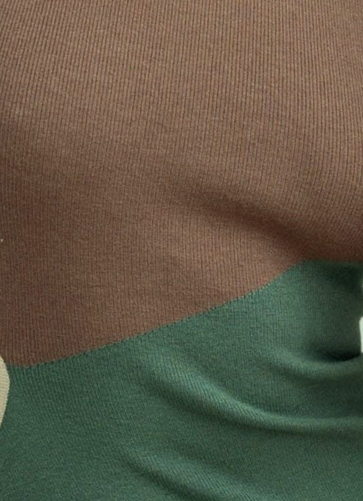 Close-up of Torez Midi Dress showing the lightly ribbed material in brown and green with unique color blocking.