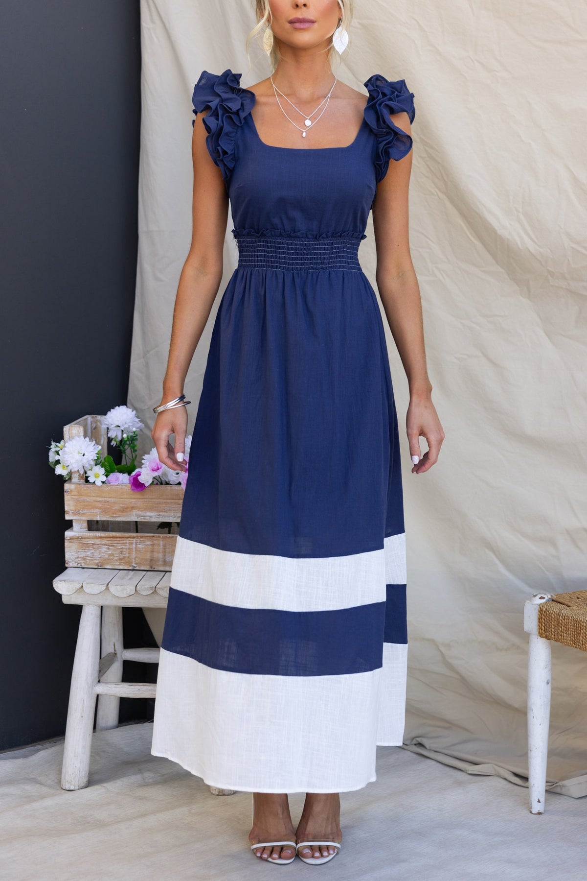 Navy Kape Maxi Dress with ruffled sleeves, elastic waistband, and a white striped design, perfect for summer occasions.