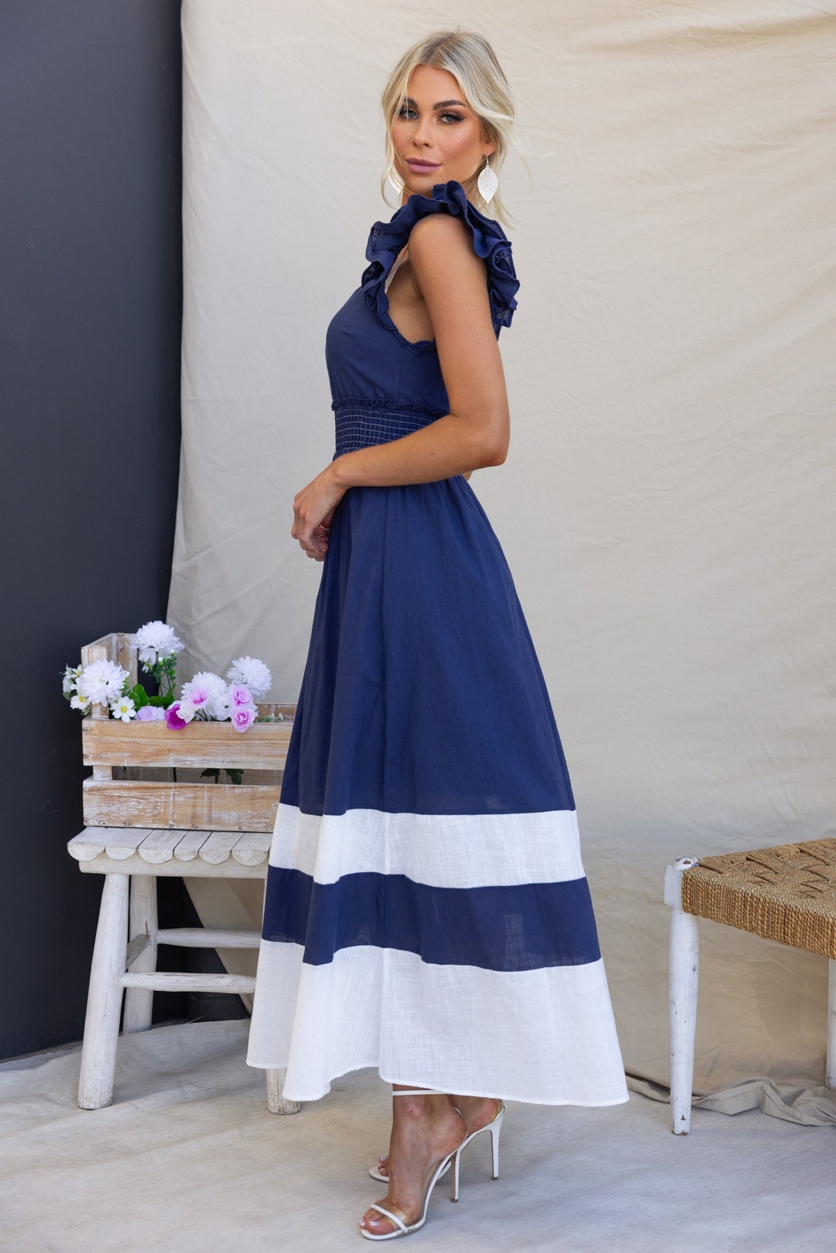 Navy Kape Maxi Dress with ruffled sleeves and white stripes, showcasing a stylish look for summer occasions.