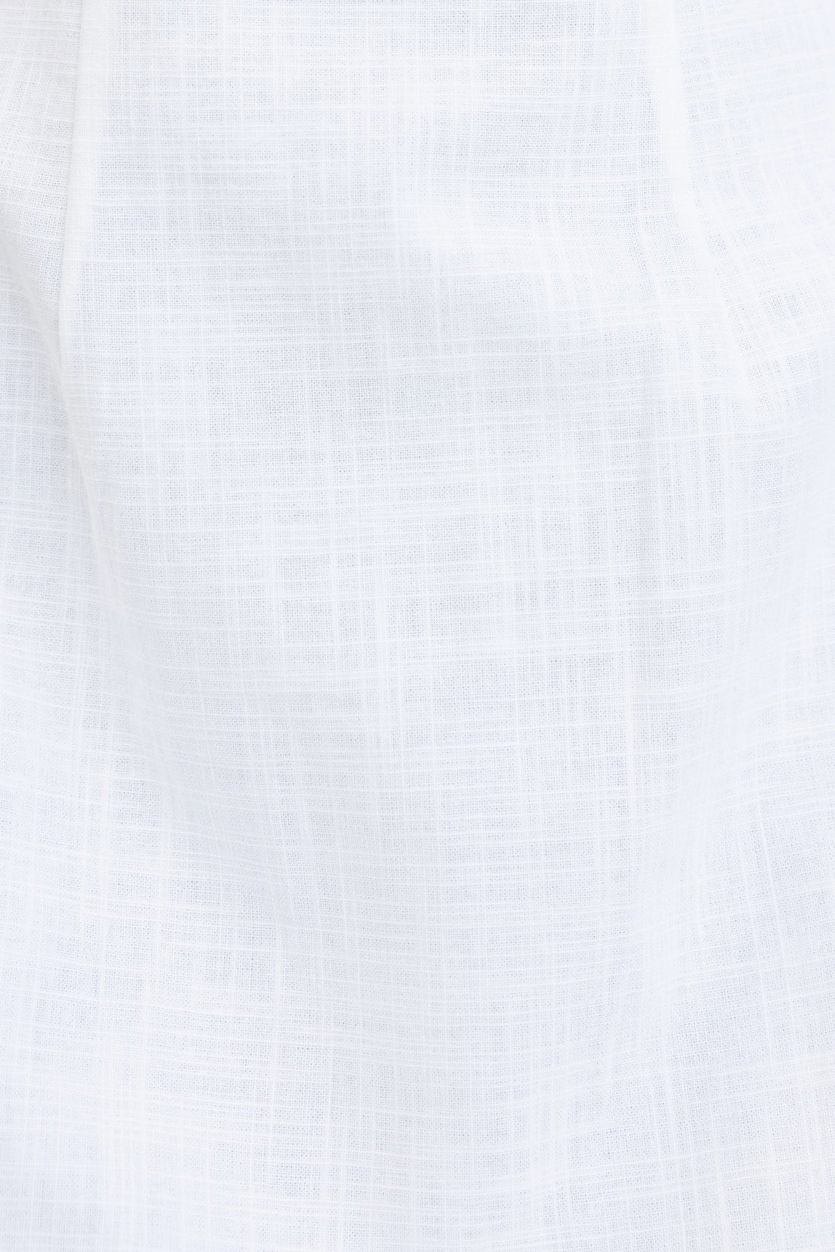 Close-up of lightweight, textured white fabric with a linen look, ideal for a stylish summer maxi dress.